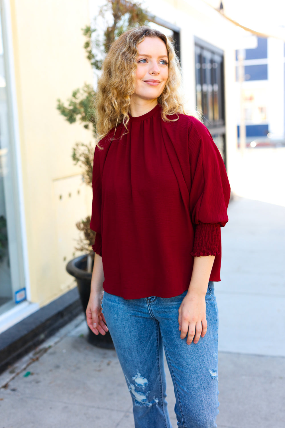 Bold Dreams Wine Smocked Three Quarter Sleeve Tie Back Top - Charming Charlie