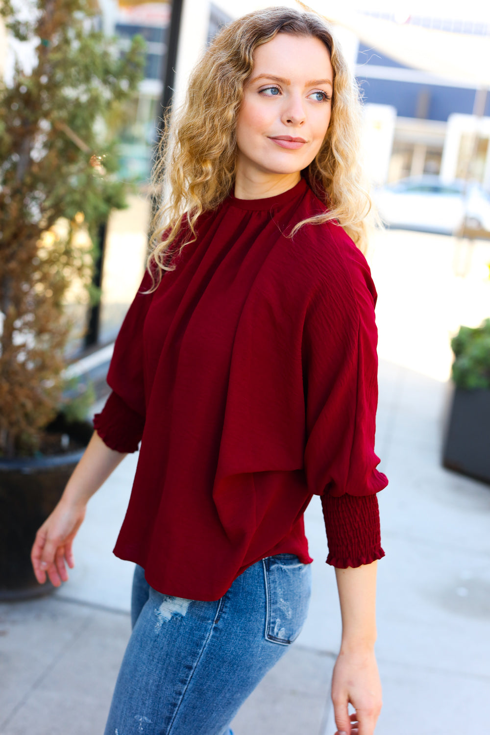 Bold Dreams Wine Smocked Three Quarter Sleeve Tie Back Top - Charming Charlie