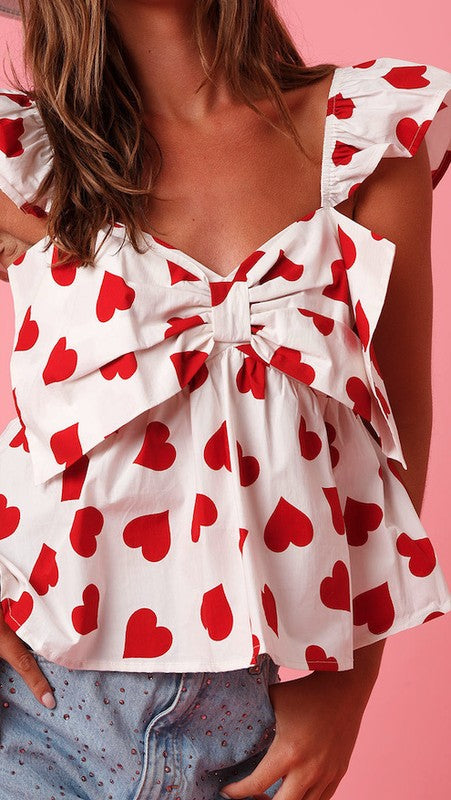 All over heart bow v-neck top - Charming Charlie
