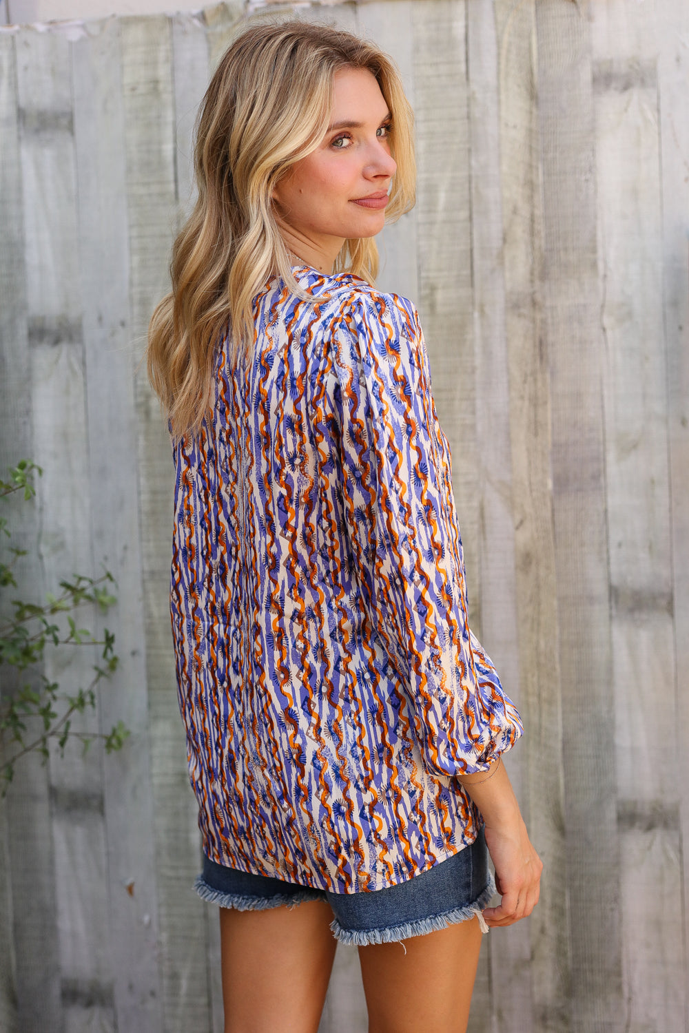 On A Wild Streak V Neck Fabric Button Detail Blouse - Charming Charlie