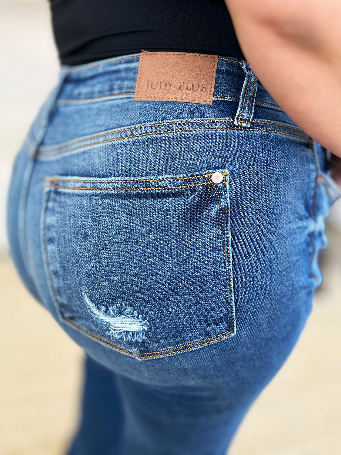 Judy Blue Full Size Mid Rise Distressed Raw Hem Jeans - Charming Charlie