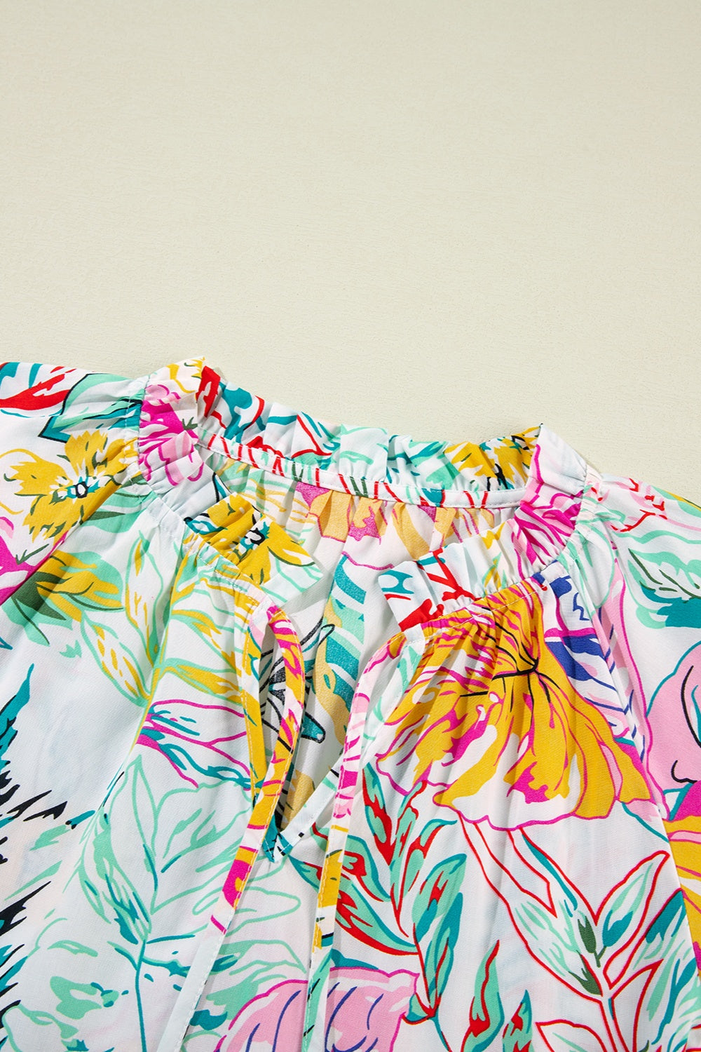 Ruffled Printed Tie Neck Blouse - Charming Charlie