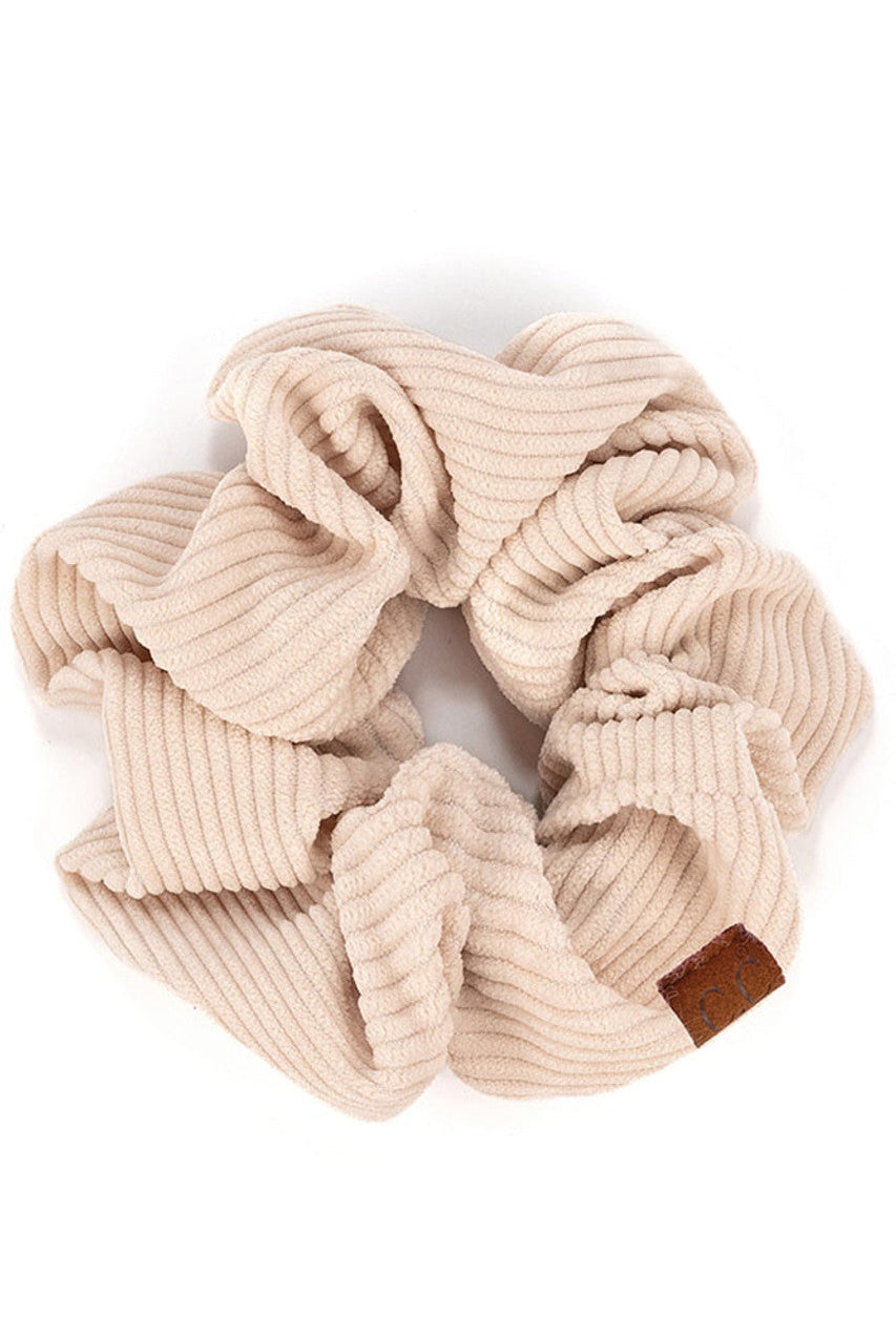 Beige C.C Corduroy Solid Color Soft Scrunchies are a must-have for any hair accessory collection. Made from soft and durable corduroy material, these scrunchies are perfect for any hair type and can hold hair in place comfortably without causing any damage. Add some style to your hairstyle with these versatile and fashionable scrunchies.