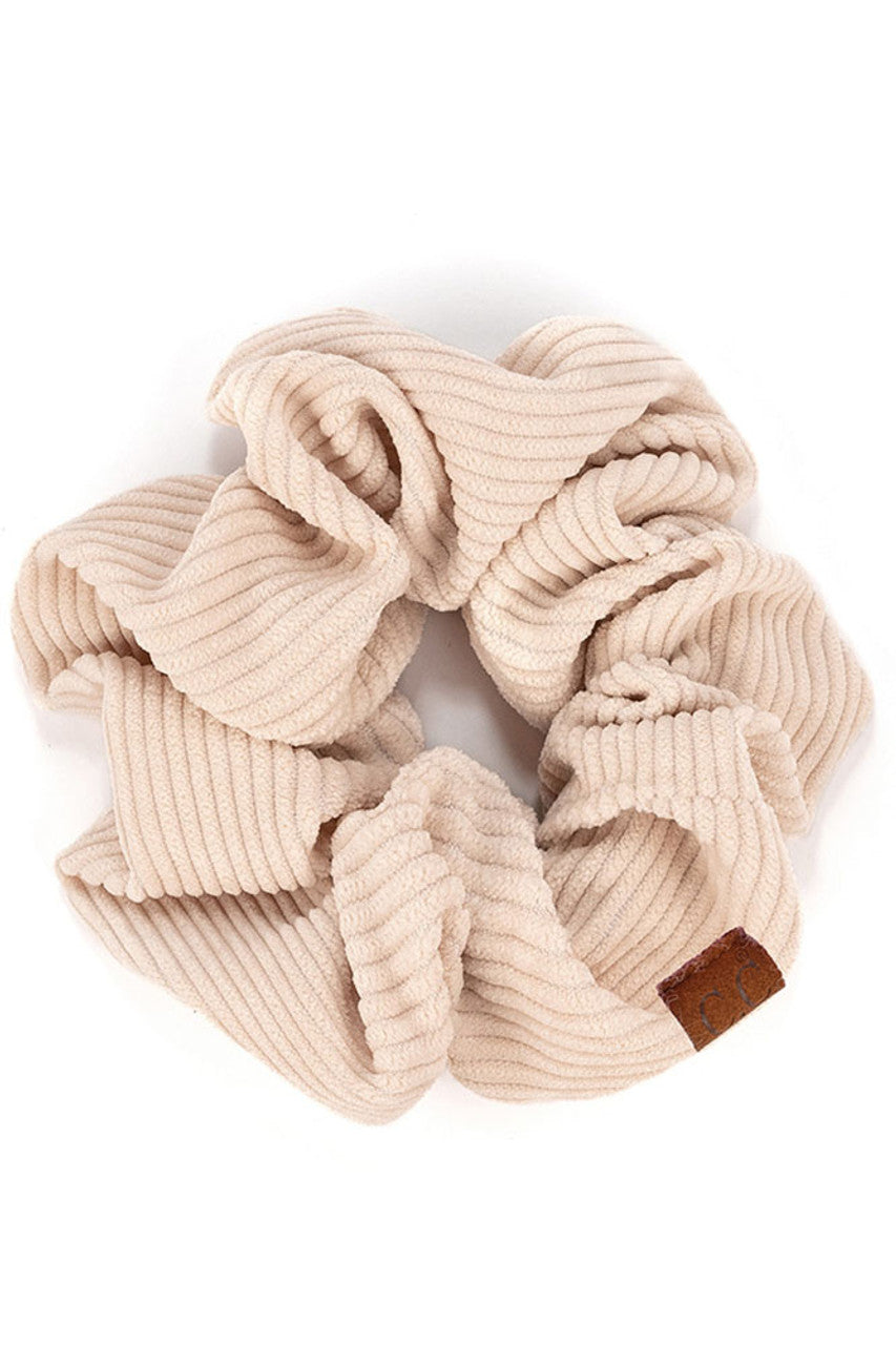Beige C.C Corduroy Solid Color Soft Scrunchies are a must-have for any hair accessory collection. Made from soft and durable corduroy material, these scrunchies are perfect for any hair type and can hold hair in place comfortably without causing any damage. Add some style to your hairstyle with these versatile and fashionable scrunchies.