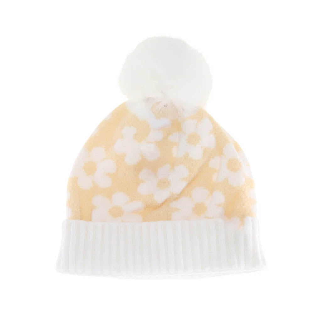 Beige KIDS Daisy Faux Fur Pom C.C Beanie combines warmth and style for active children. Crafted from soft, insulating material, it provides cozy protection during cold weather. The playful faux fur pom adds a fun, fashionable touch, making it ideal for everyday wear or outdoor activities. Durable and easy to wear, this beanie offers both comfort and a snug fit for kids on the go.