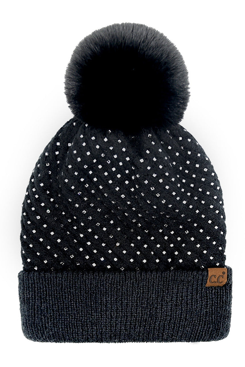 Black C.C Allover Rhinestone Pom Beanie combines expert craftsmanship with stylish practicality. Crafted from soft, warm knit material, this beanie is adorned with shimmering rhinestones for an elegant yet understated sparkle. The plush pom on top adds a classic touch while ensuring cozy protection against cold weather. Perfect for elevating your winter wardrobe, it offers a refined blend of comfort, durability, and sophistication.
