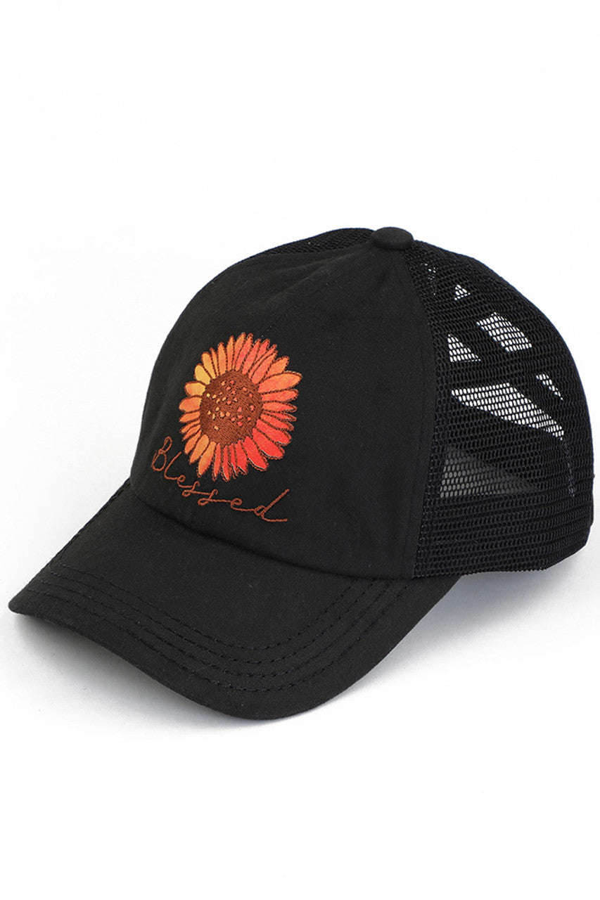 Black C.C DAISY PATCH BLESSED PONY CAP is the perfect accessory for any ponytail! With the bonus of a daisy patch, this cap not only keeps you in style but also adds a touch of femininity to your look. Keep your hair out of your face and elevate your outfit with this cap.