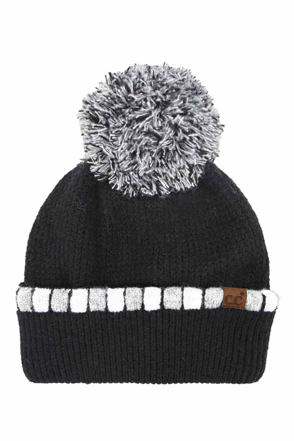 Black Wrap yourself in cozy chic with the C.C Neutral Horizontal Stripe Pom Beanie. Its stylish cuffed design and charming pom detail add a playful touch to any outfit. Perfect for brisk days out or cozy nights in, this beanie is a must-have accessory for the modern woman on the go. Elevate your winter wardrobe or gift it to a fashion-forward friend. Stay warm, stay fabulous!