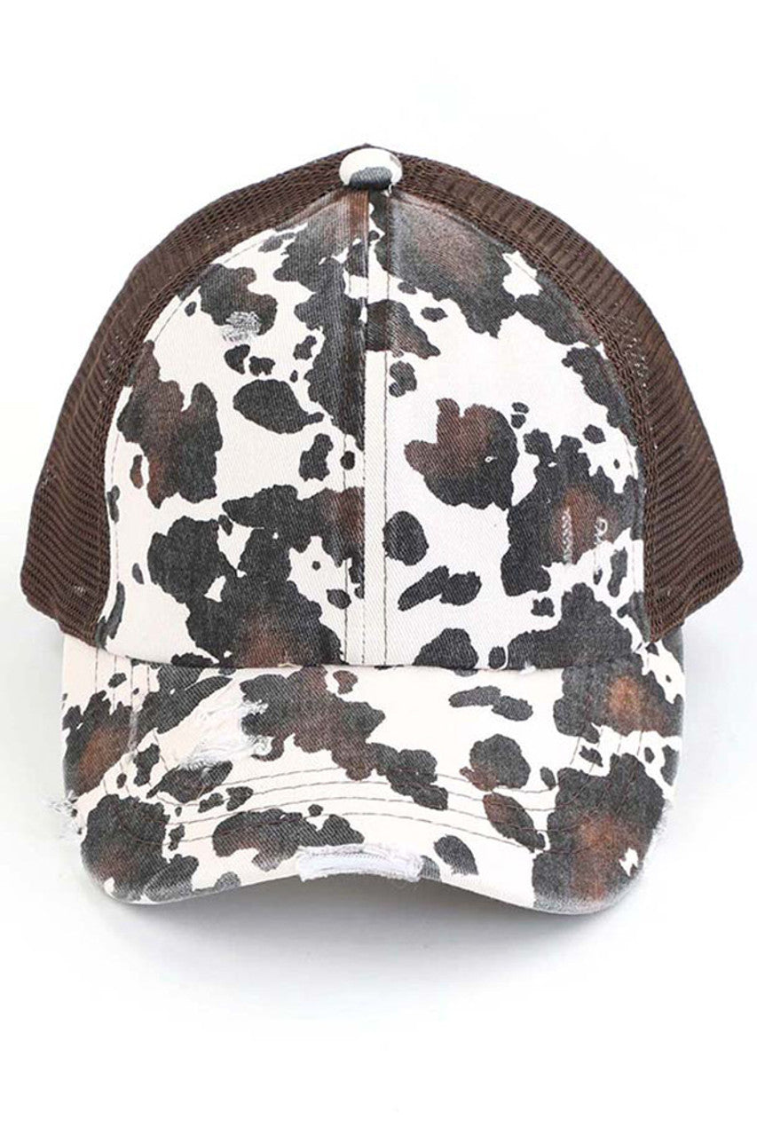 Brown C.C cow print criss cross ponycap is the perfect blend of style and functionality. The adjustable criss cross design allows for a comfortable and secure fit, while the unique cow print pattern adds a touch of fun to any outfit. Made with high-quality materials, this ponycap is durable and long-lasting.