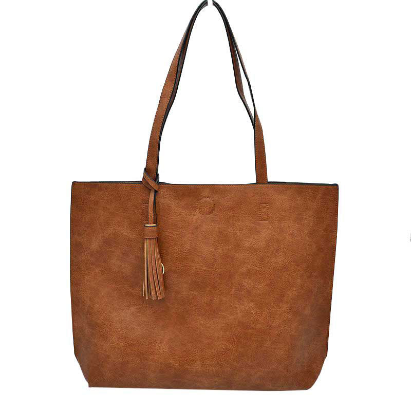 Brown Large Tote Reversible Shoulder Vegan Leather Tassel Handbag, High quality Vegan Leather is a luxurious and durable, Stay organized in style with this square-shaped shopper tote purse that is fully reversible for two contrasting interior and exterior solid colors. This vegan leather handbag includes an on-trend removable tassel embellishment. Guaranteed, This will be your go-to handbag.