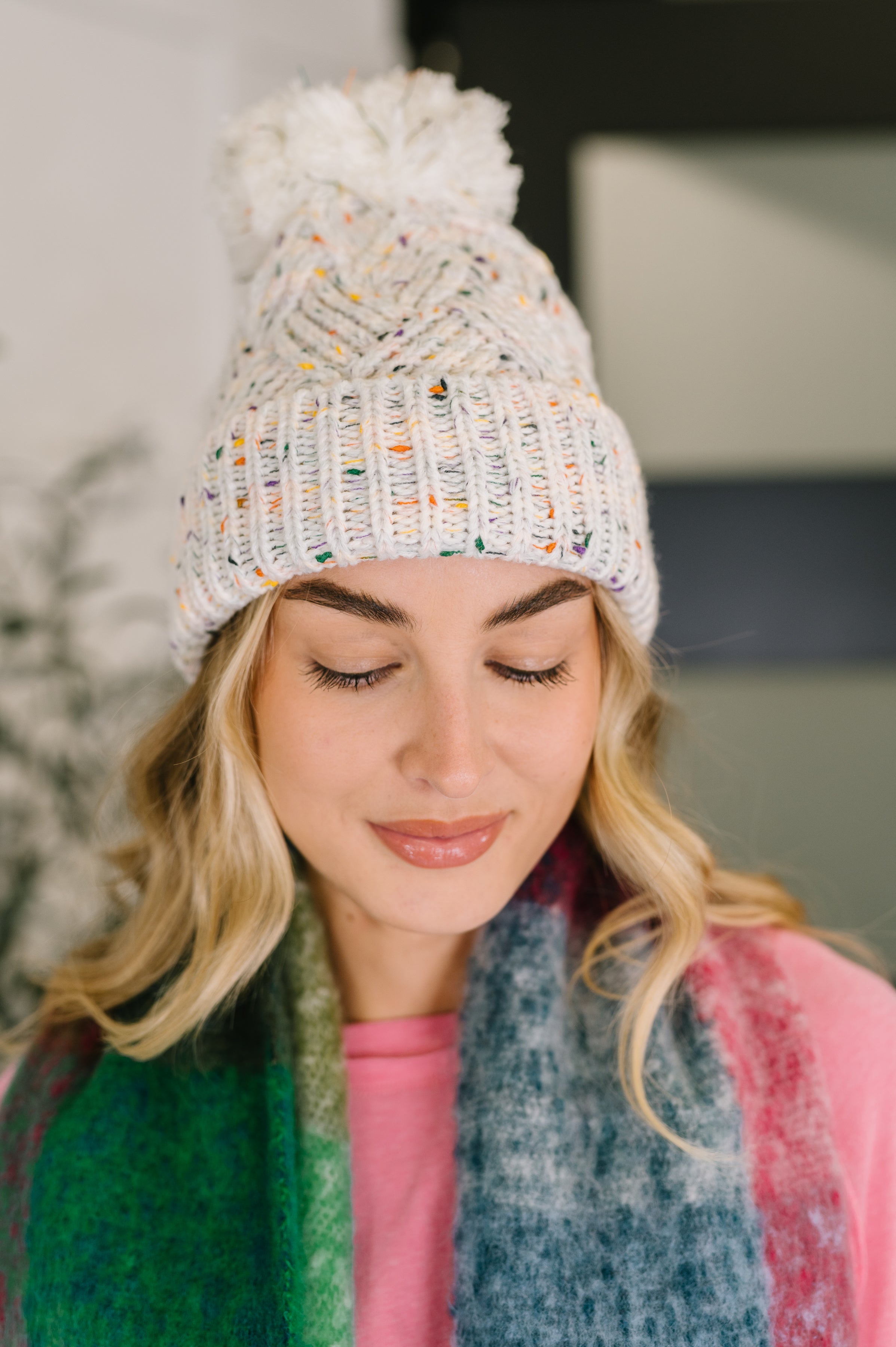 Cover Your Ears Pom Pom Beanie in Ivory - Charming Charlie