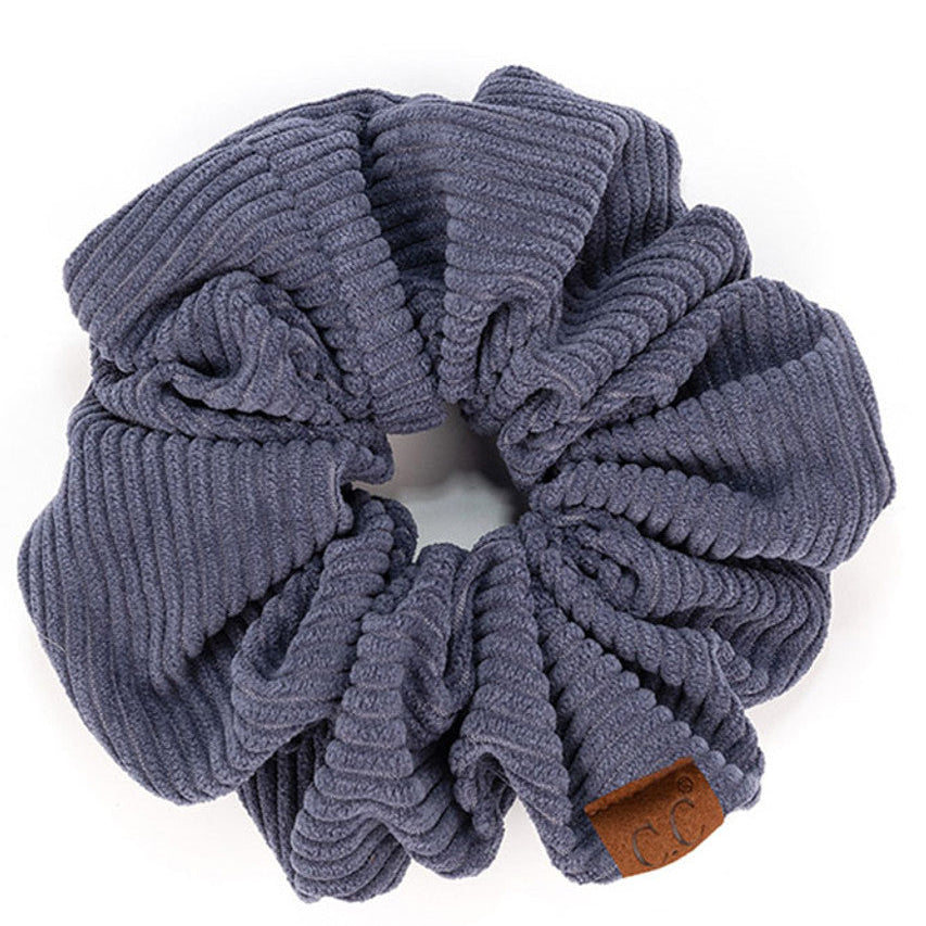 DarkDenim C.C Corduroy Solid Color Soft Scrunchies are a must-have for any hair accessory collection. Made from soft and durable corduroy material, these scrunchies are perfect for any hair type and can hold hair in place comfortably without causing any damage. Add some style to your hairstyle with these versatile and fashionable scrunchies.