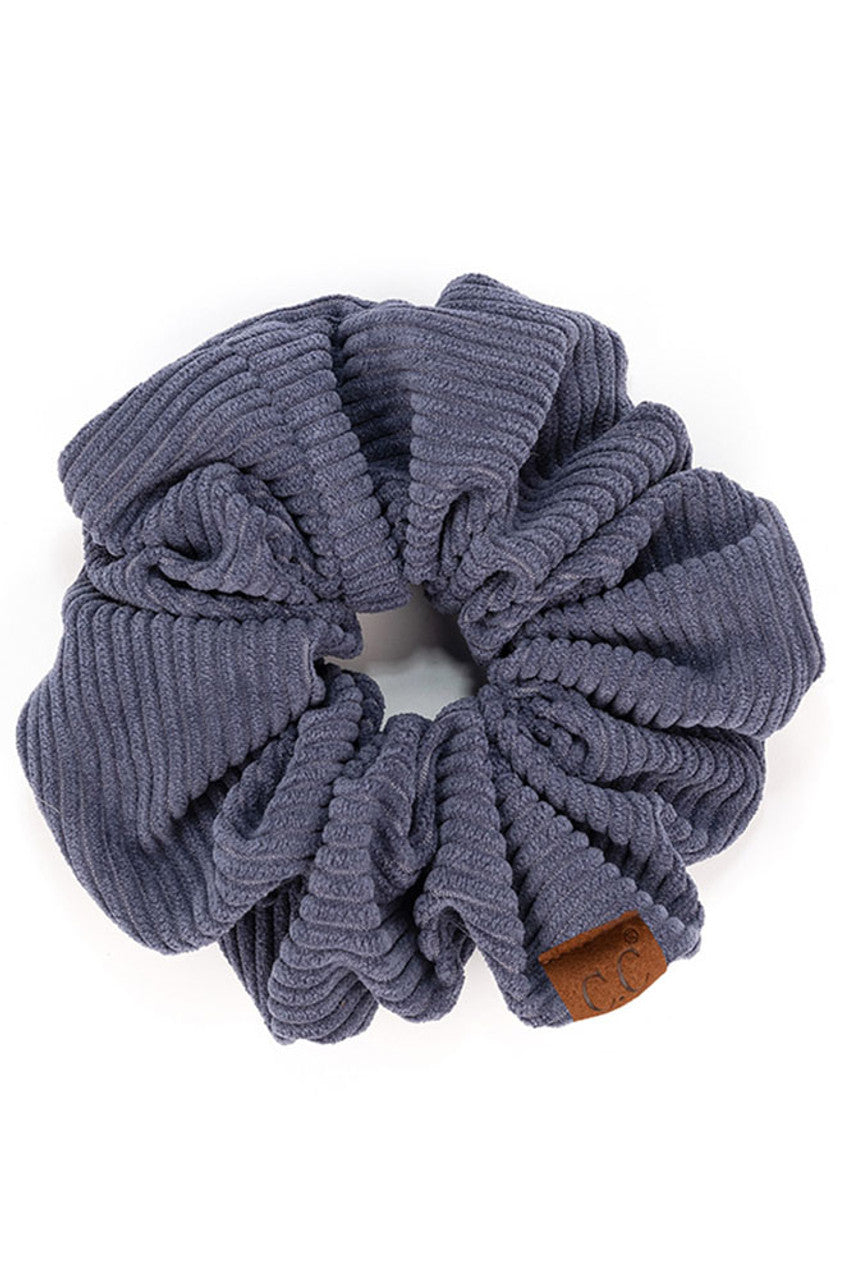 DarkDenim C.C Corduroy Solid Color Soft Scrunchies are a must-have for any hair accessory collection. Made from soft and durable corduroy material, these scrunchies are perfect for any hair type and can hold hair in place comfortably without causing any damage. Add some style to your hairstyle with these versatile and fashionable scrunchies.