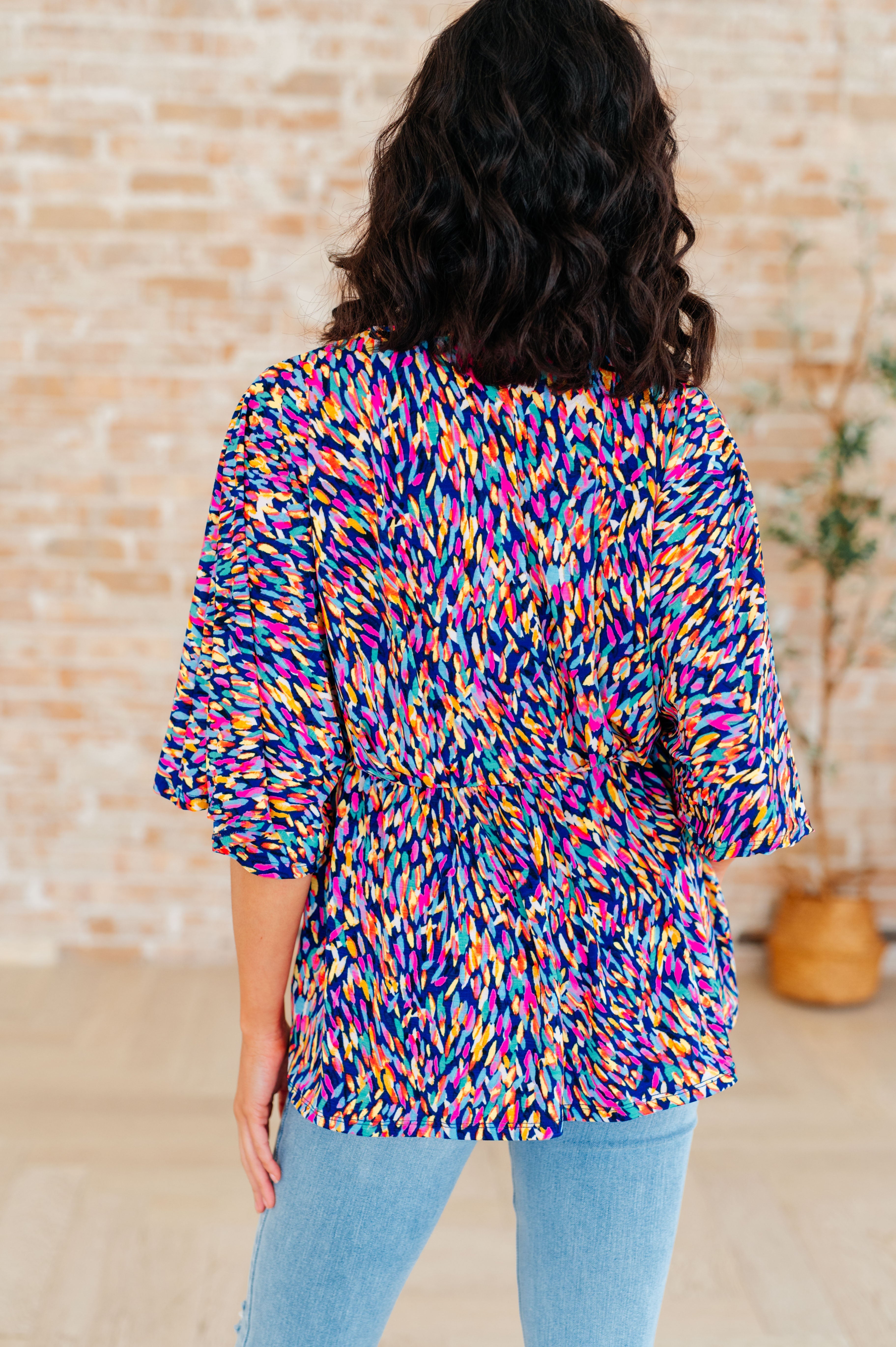 Dreamer Peplum Top in Painted Royal Multi - Charming Charlie