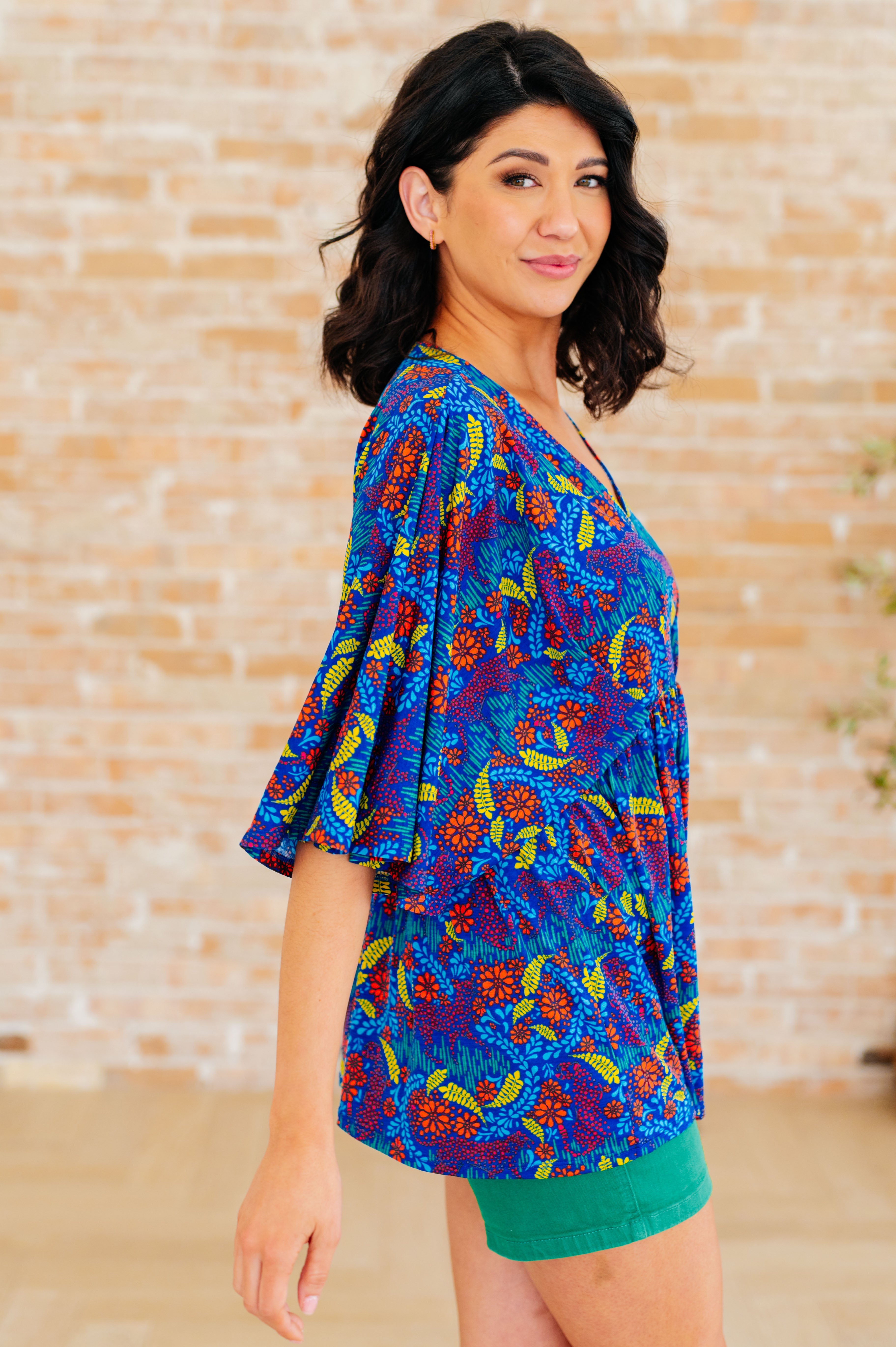 Dreamer Peplum Top in Royal and Red Abstract - Charming Charlie
