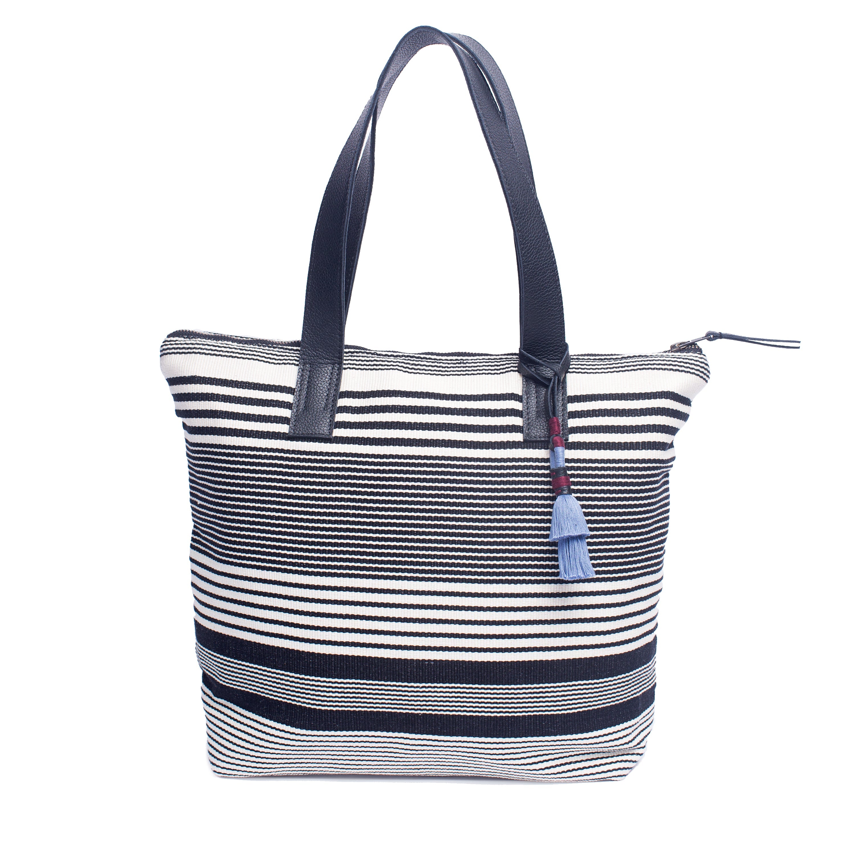 Angela Handwoven artisan Angela Tote in Black White Stripes. It has leather handles and a light blue tassel.