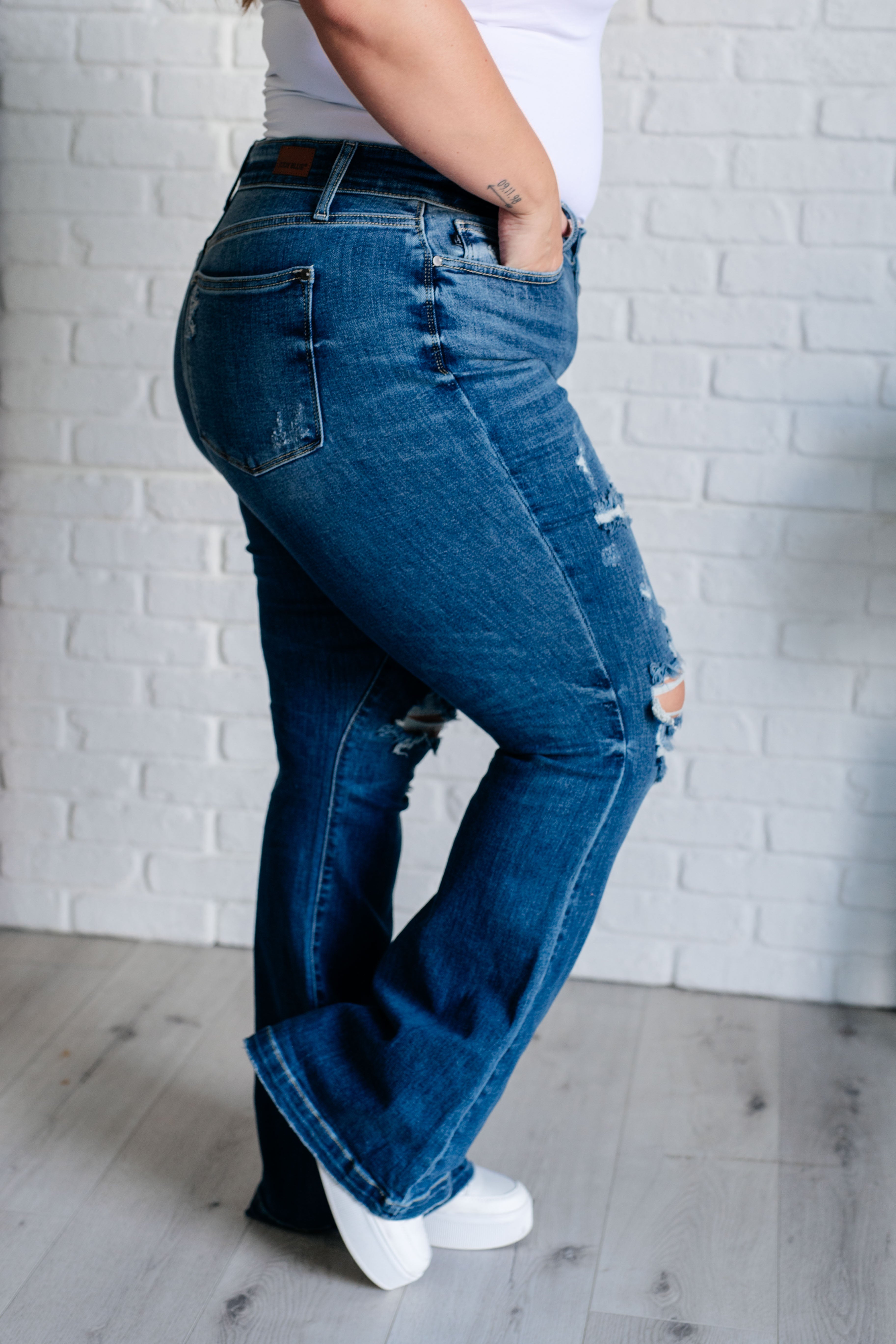 Gabriella Mid Rise Distressed Button Fly Flare - Charming Charlie
