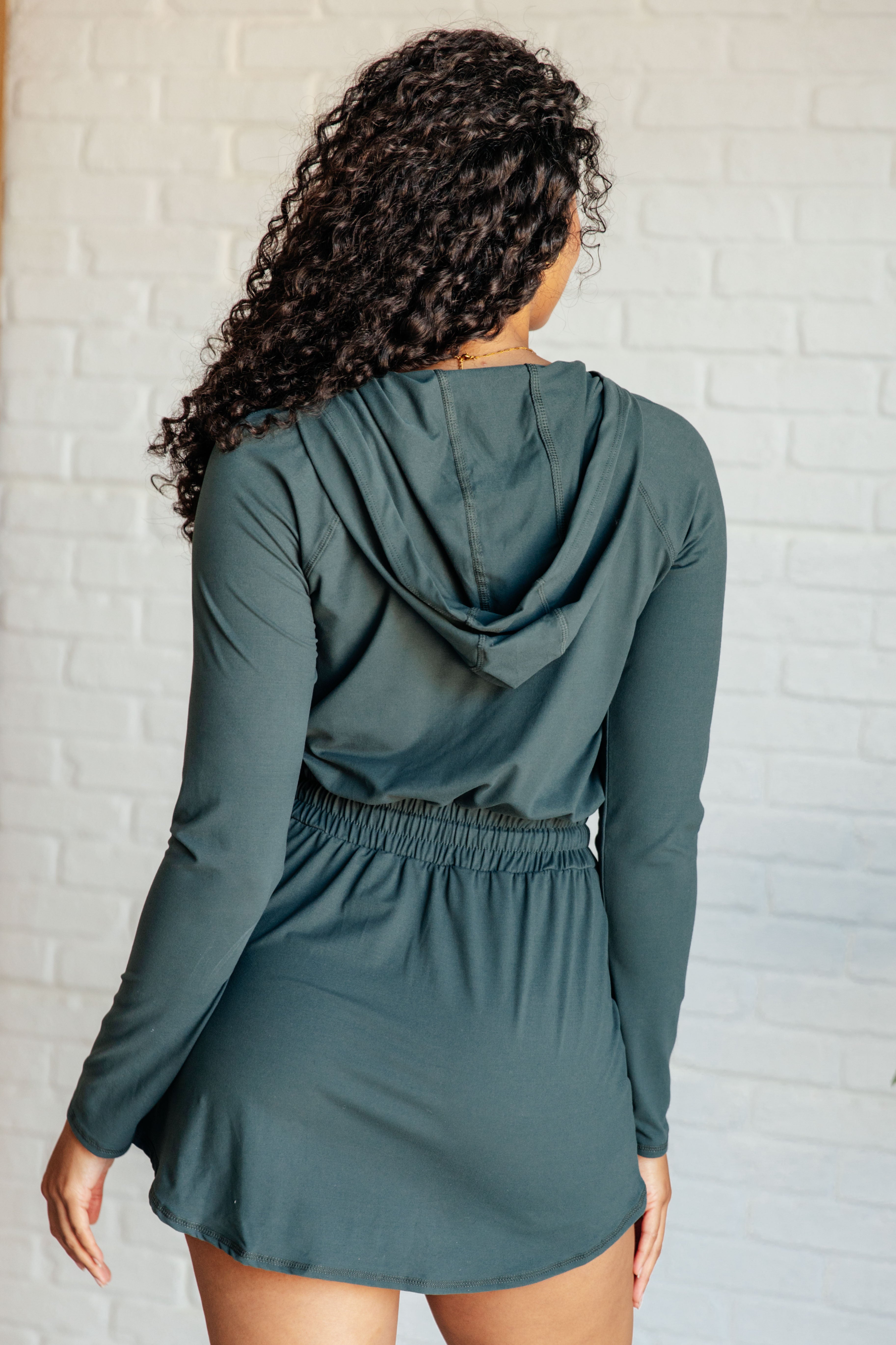 Getting Out Long Sleeve Hoodie Romper in Smoked Spruce - Charming Charlie