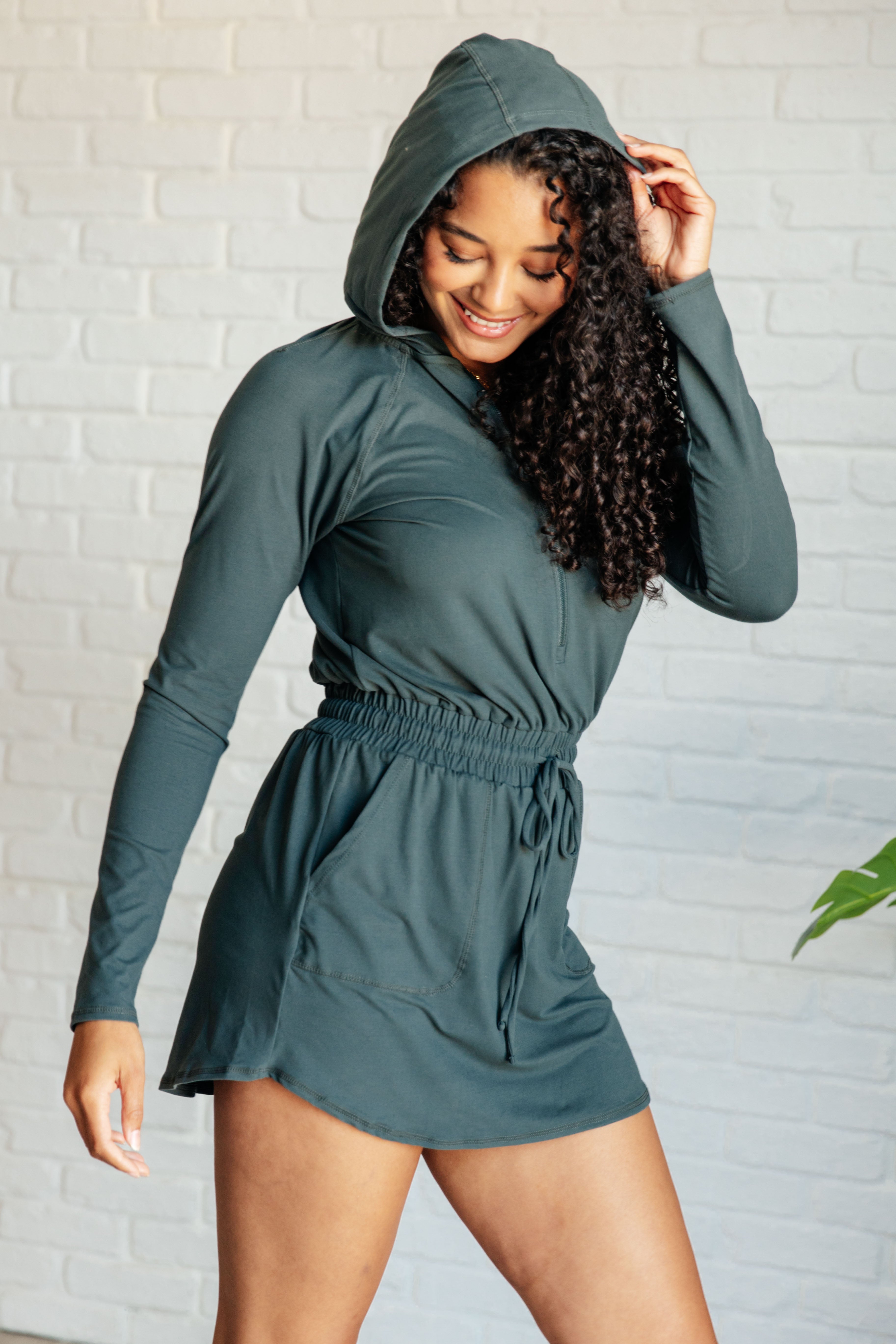 Getting Out Long Sleeve Hoodie Romper in Smoked Spruce - Charming Charlie