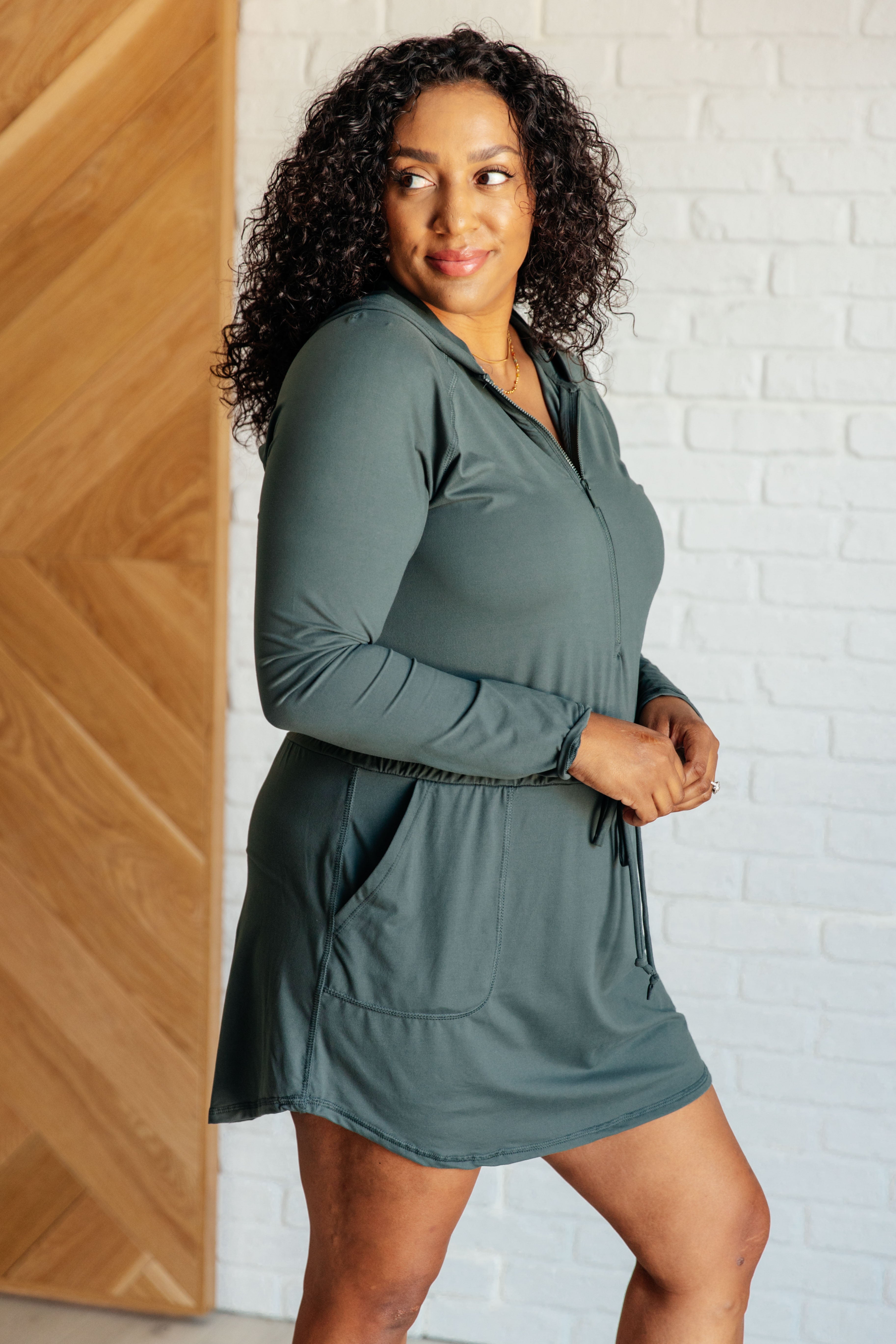 Getting Out Long Sleeve Hoodie Romper in Smoked Spruce - Charming Charlie