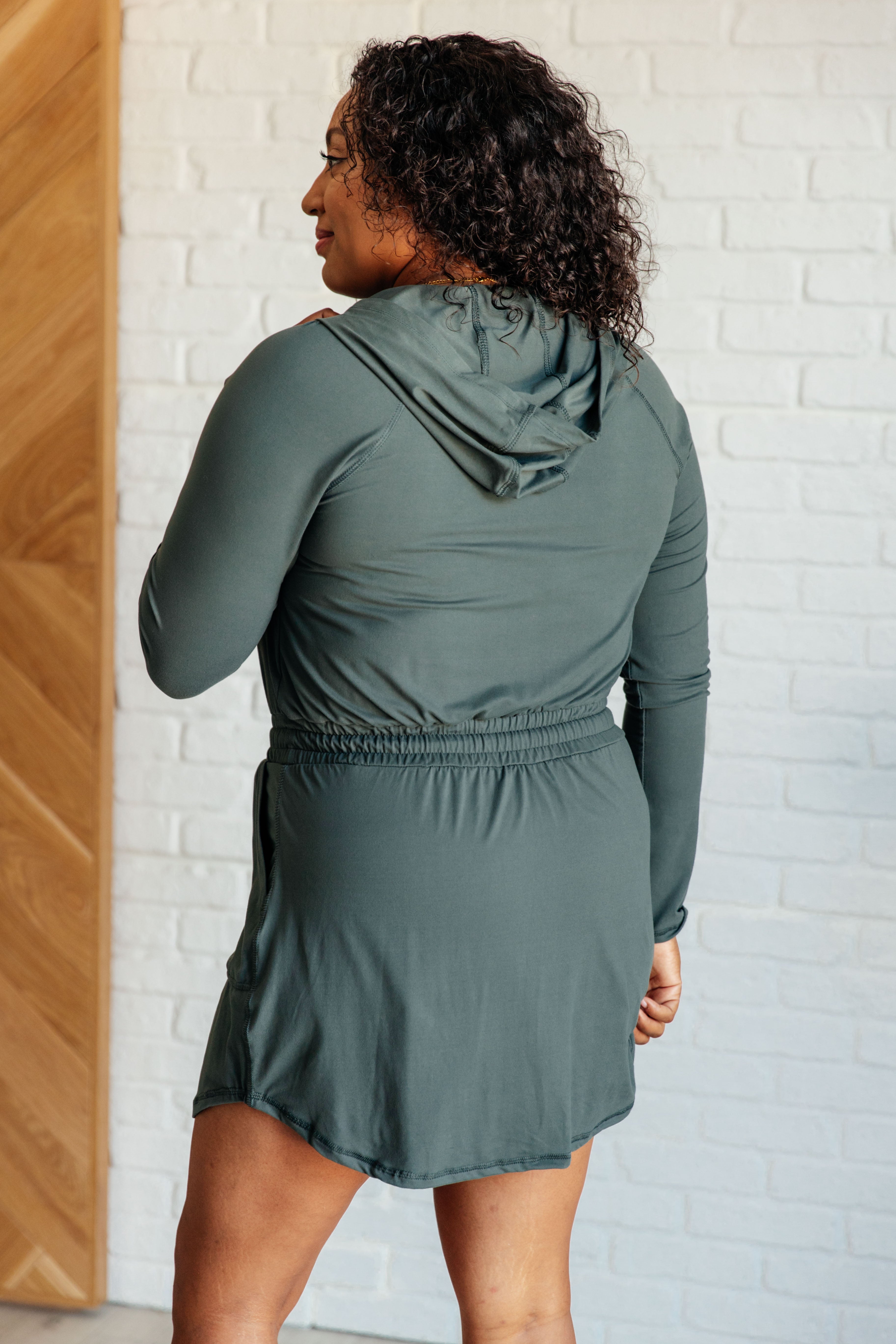 Getting Out Long Sleeve Hoodie Romper in Smoked Spruce - Charming Charlie