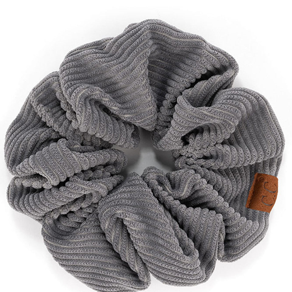 Grey C.C Corduroy Solid Color Soft Scrunchies are a must-have for any hair accessory collection. Made from soft and durable corduroy material, these scrunchies are perfect for any hair type and can hold hair in place comfortably without causing any damage. Add some style to your hairstyle with these versatile and fashionable scrunchies.