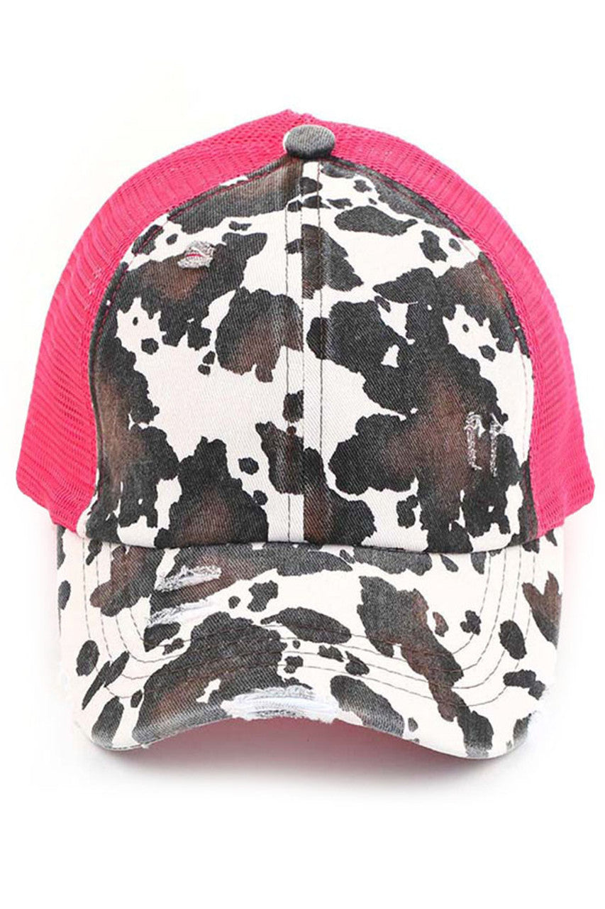 Hot Pink C.C cow print criss cross ponycap is the perfect blend of style and functionality. The adjustable criss cross design allows for a comfortable and secure fit, while the unique cow print pattern adds a touch of fun to any outfit. Made with high-quality materials, this ponycap is durable and long-lasting.