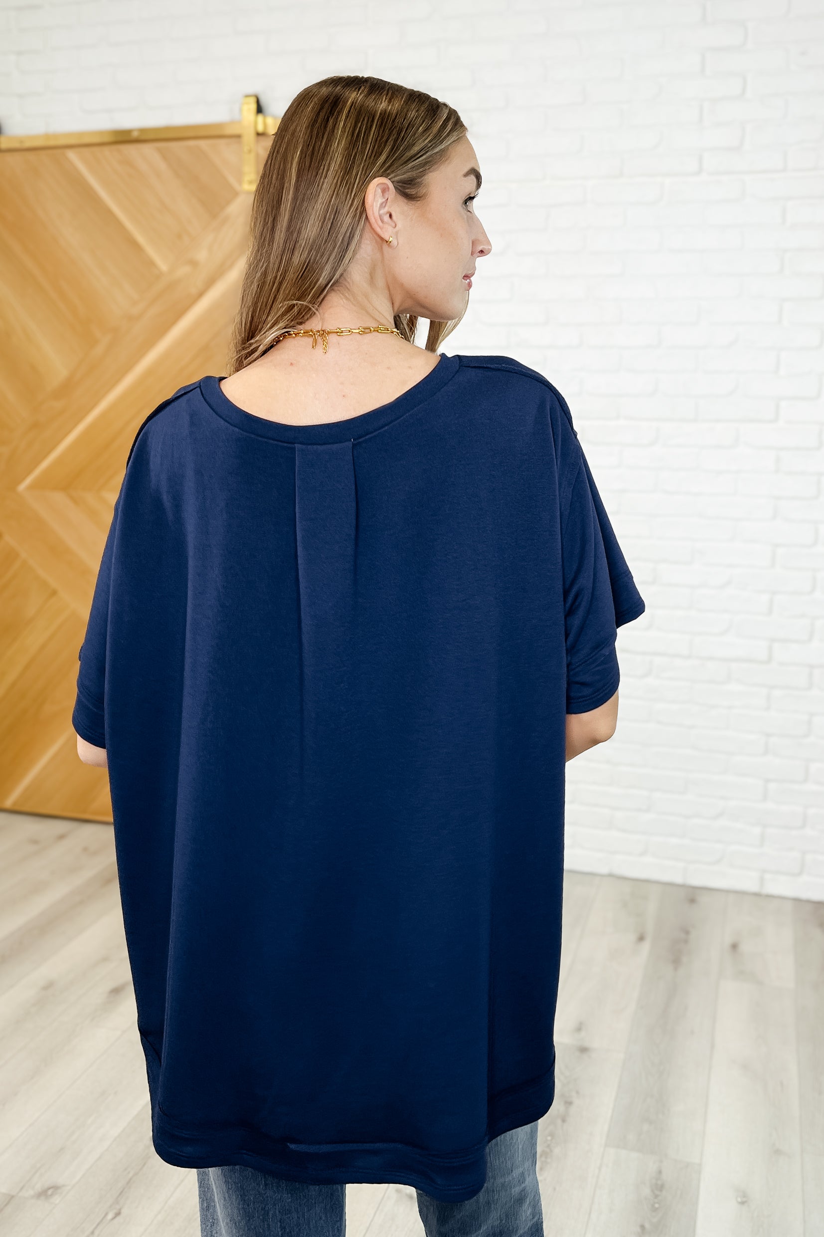 In the Rotation Exposed Seam Tee in Navy - Charming Charlie