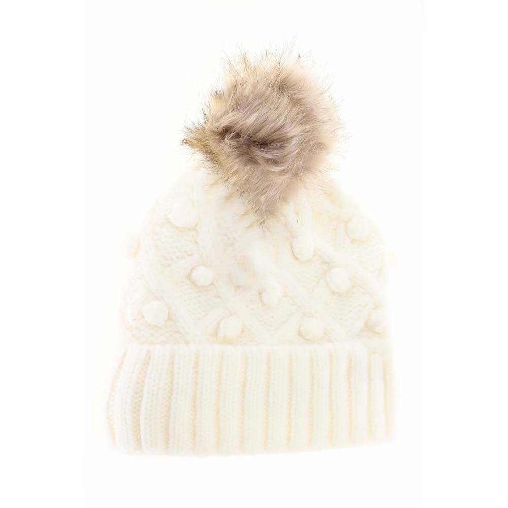 Ivory KIDS Bobble Knit Faux Fur Pom C.C Beanie combines warmth and style, offering cozy comfort with its soft knit fabric and a plush faux fur pom-pom. Designed specifically for children, it provides a secure, comfortable fit to keep little heads warm during colder months while adding a playful, fashionable touch. Durable and easy to wear, this beanie is ideal for everyday winter activities.