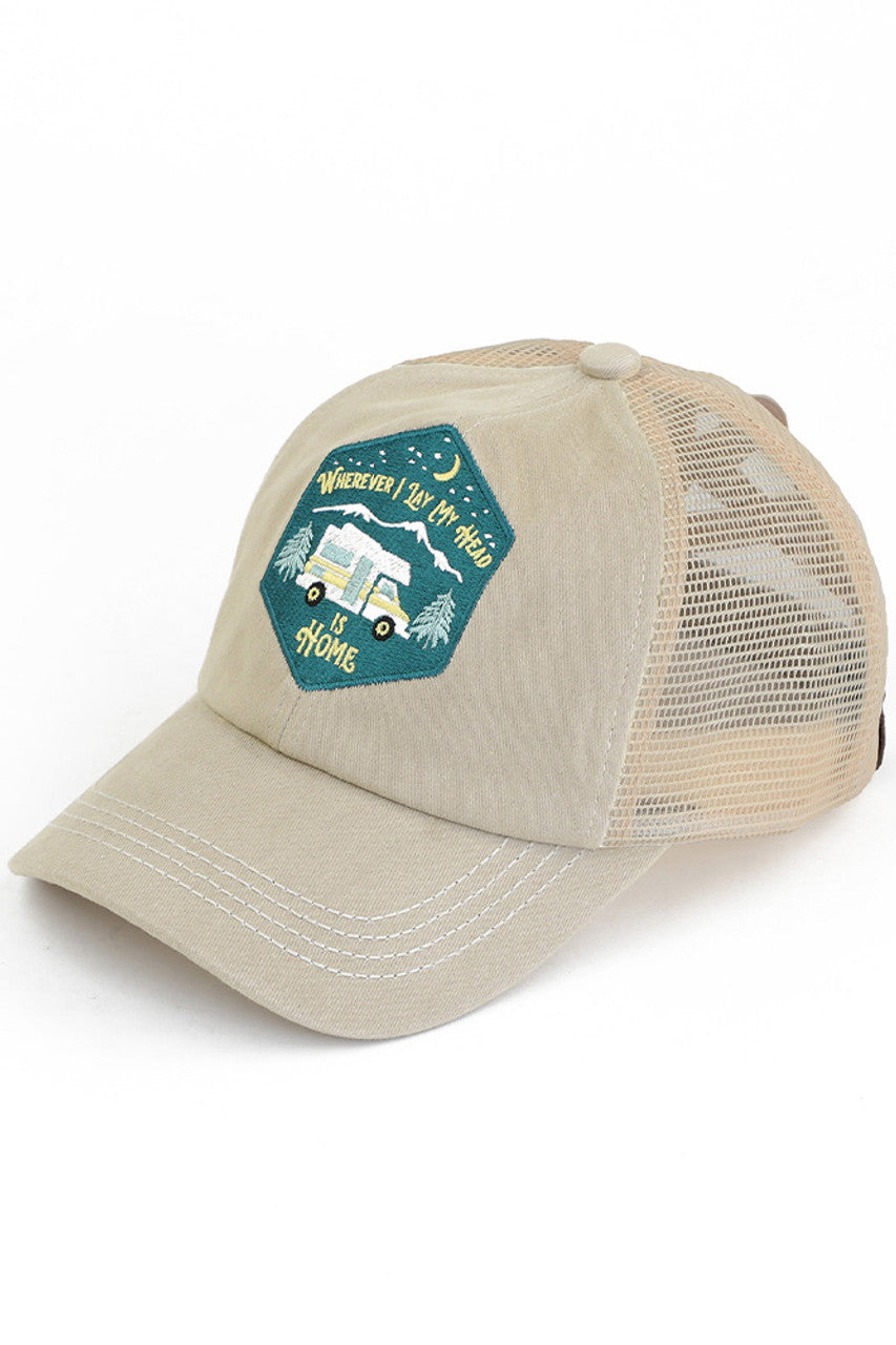 Khaki C.C WHEREVER I LAY MY HEAD IS HOME PATCH PONY CAP is the perfect accessory for any outdoor adventure. Made with high-quality materials, this cap features a unique "home patch" design, providing comfort and sun protection. This stylish and practical pony cap shows off your love for the great outdoors.