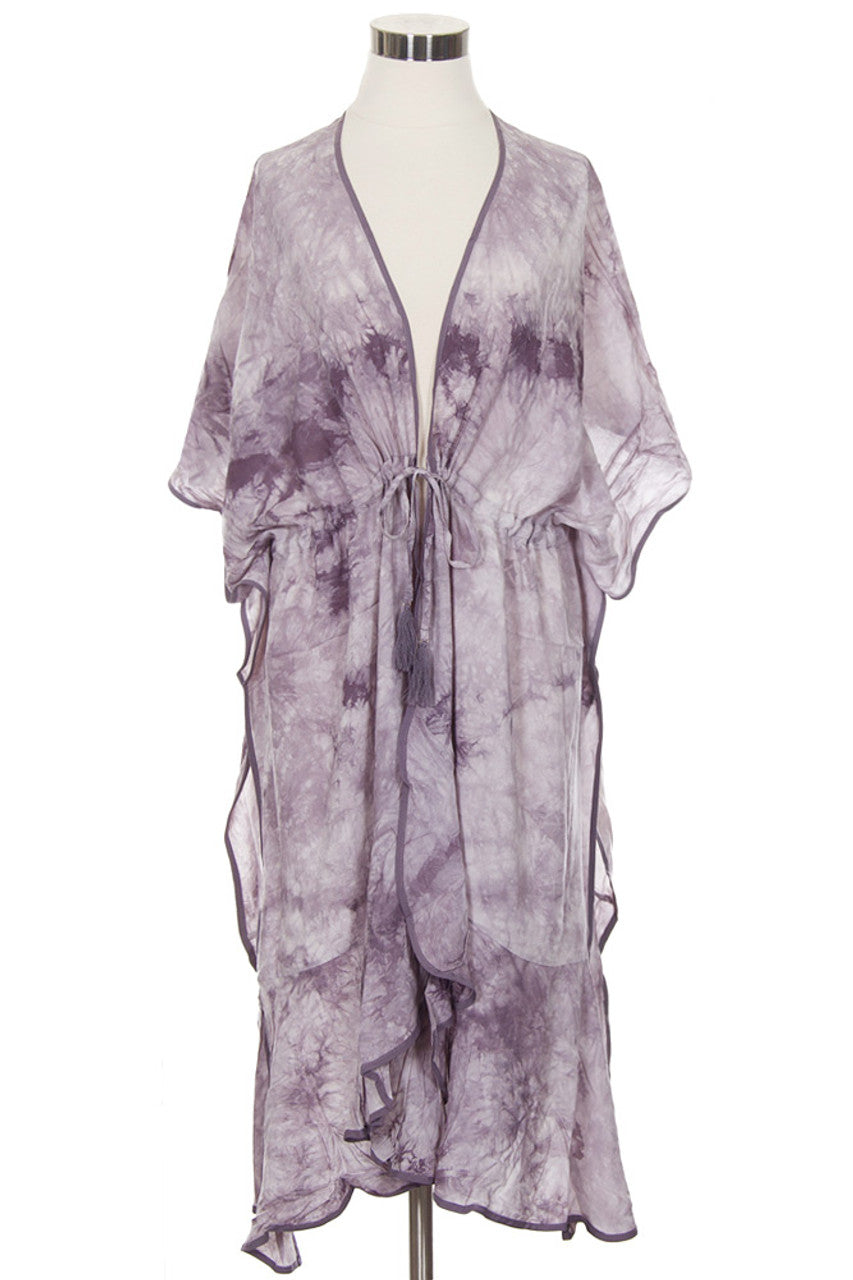 Light Grey C.C. Tie Dye Beach Coverup is perfect for your next beach day. Made with high-quality material, it offers both comfort and style. The vibrant tie-dye design adds a fun touch to your beach outfit, while the lightweight fabric allows for easy movement. Stay cool and fashionable with this must-have beach coverup.