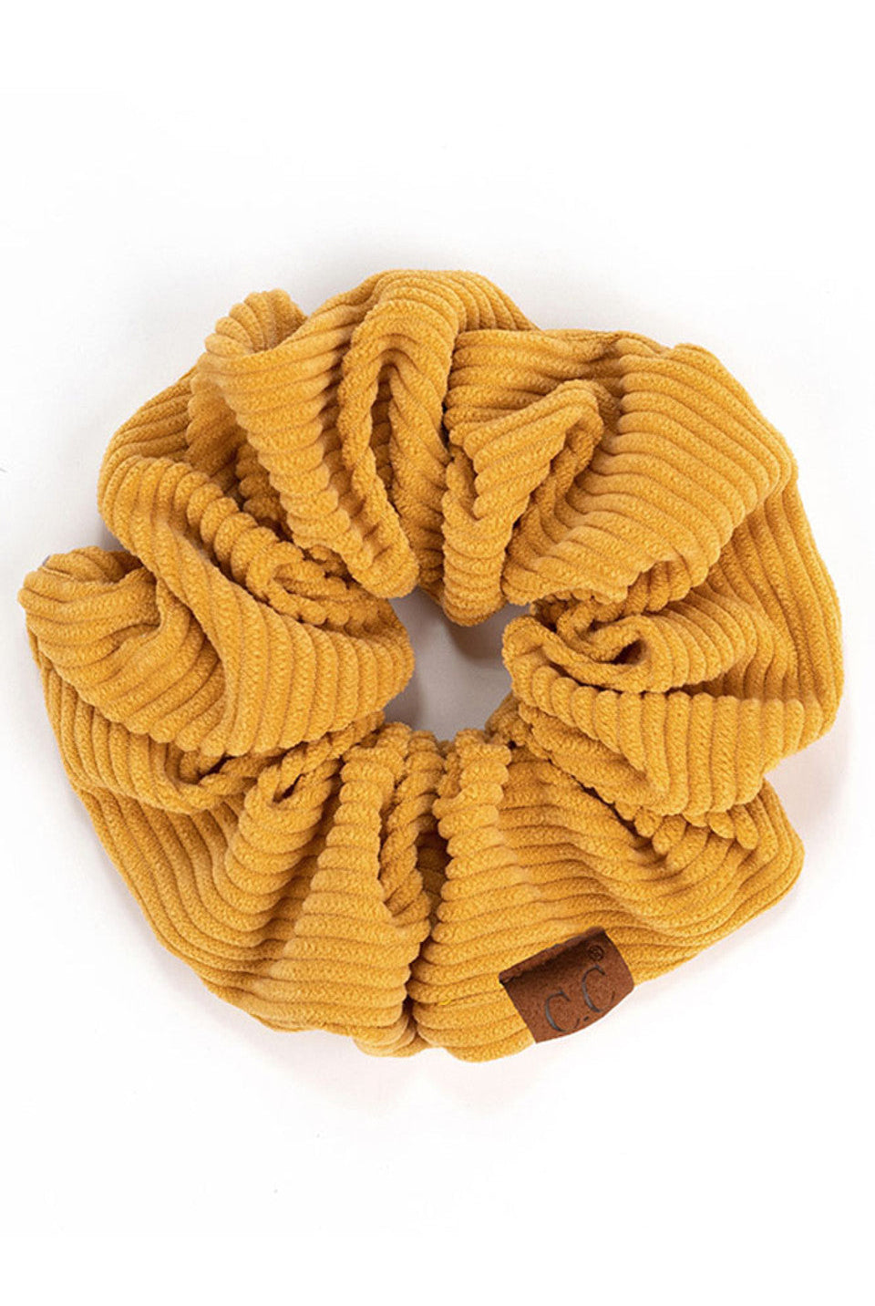Mustard C.C Corduroy Solid Color Soft Scrunchies are a must-have for any hair accessory collection. Made from soft and durable corduroy material, these scrunchies are perfect for any hair type and can hold hair in place comfortably without causing any damage. Add some style to your hairstyle with these versatile and fashionable scrunchies.