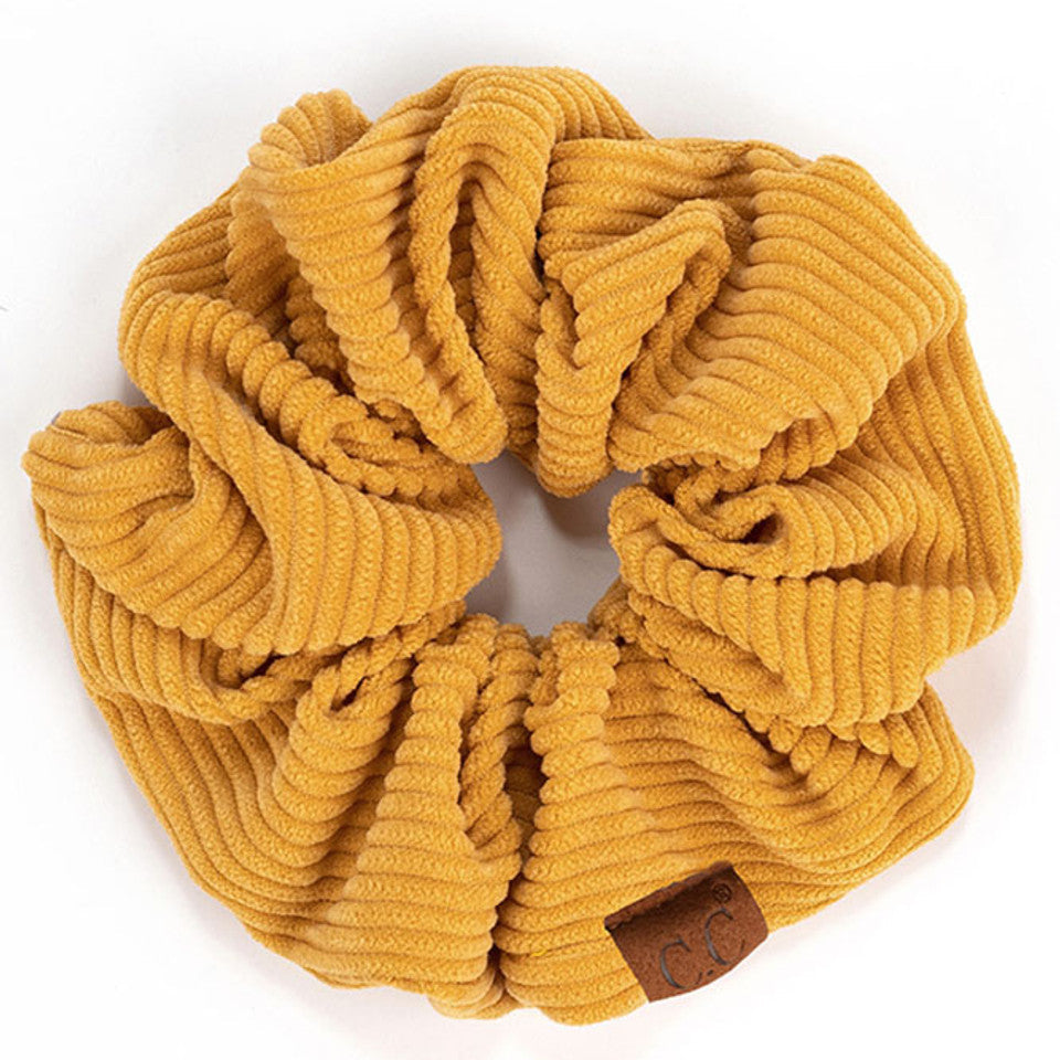 Mustard C.C Corduroy Solid Color Soft Scrunchies are a must-have for any hair accessory collection. Made from soft and durable corduroy material, these scrunchies are perfect for any hair type and can hold hair in place comfortably without causing any damage. Add some style to your hairstyle with these versatile and fashionable scrunchies.