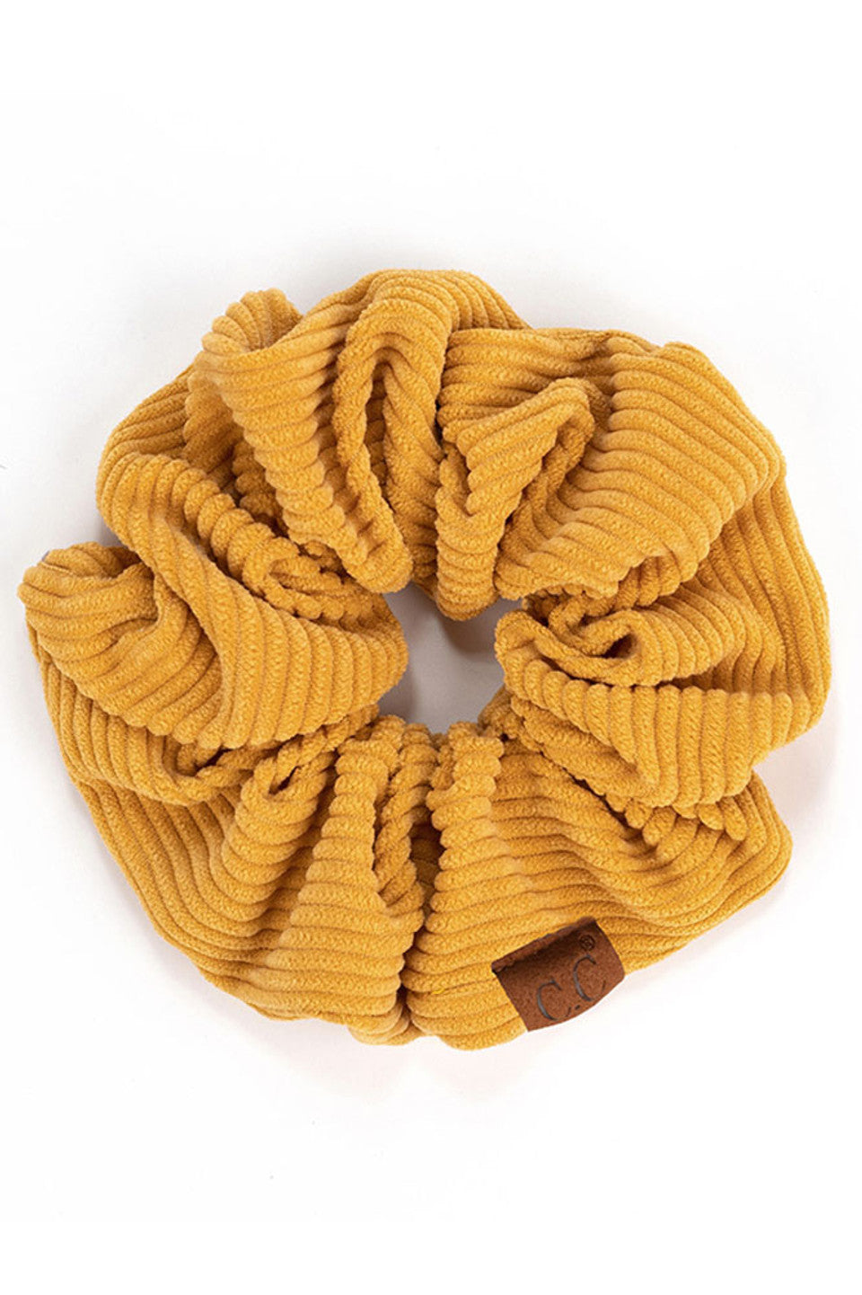Mustard C.C Corduroy Solid Color Soft Scrunchies are a must-have for any hair accessory collection. Made from soft and durable corduroy material, these scrunchies are perfect for any hair type and can hold hair in place comfortably without causing any damage. Add some style to your hairstyle with these versatile and fashionable scrunchies.