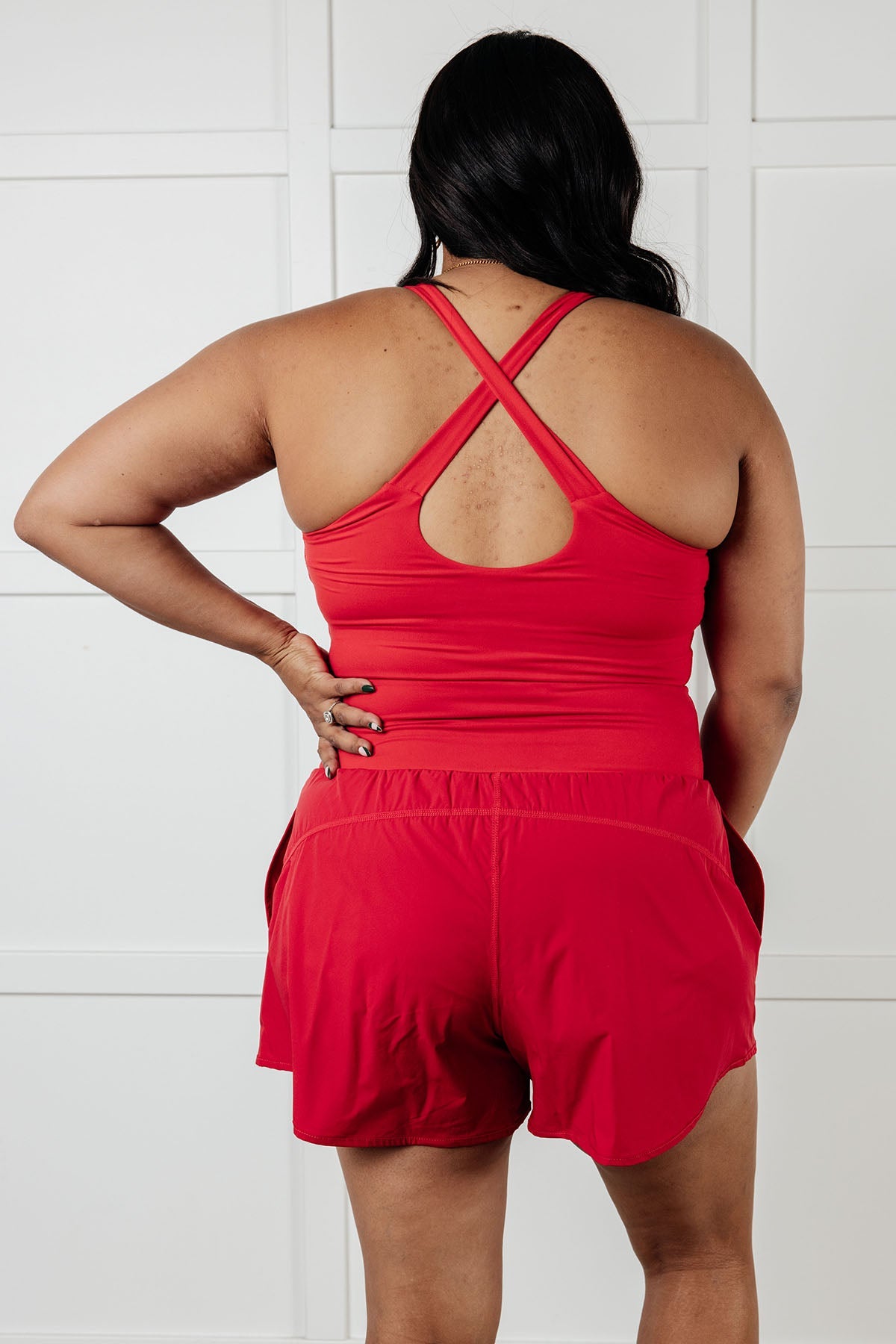 Raising Heart Rate Cutout Runsie In True Red - Charming Charlie