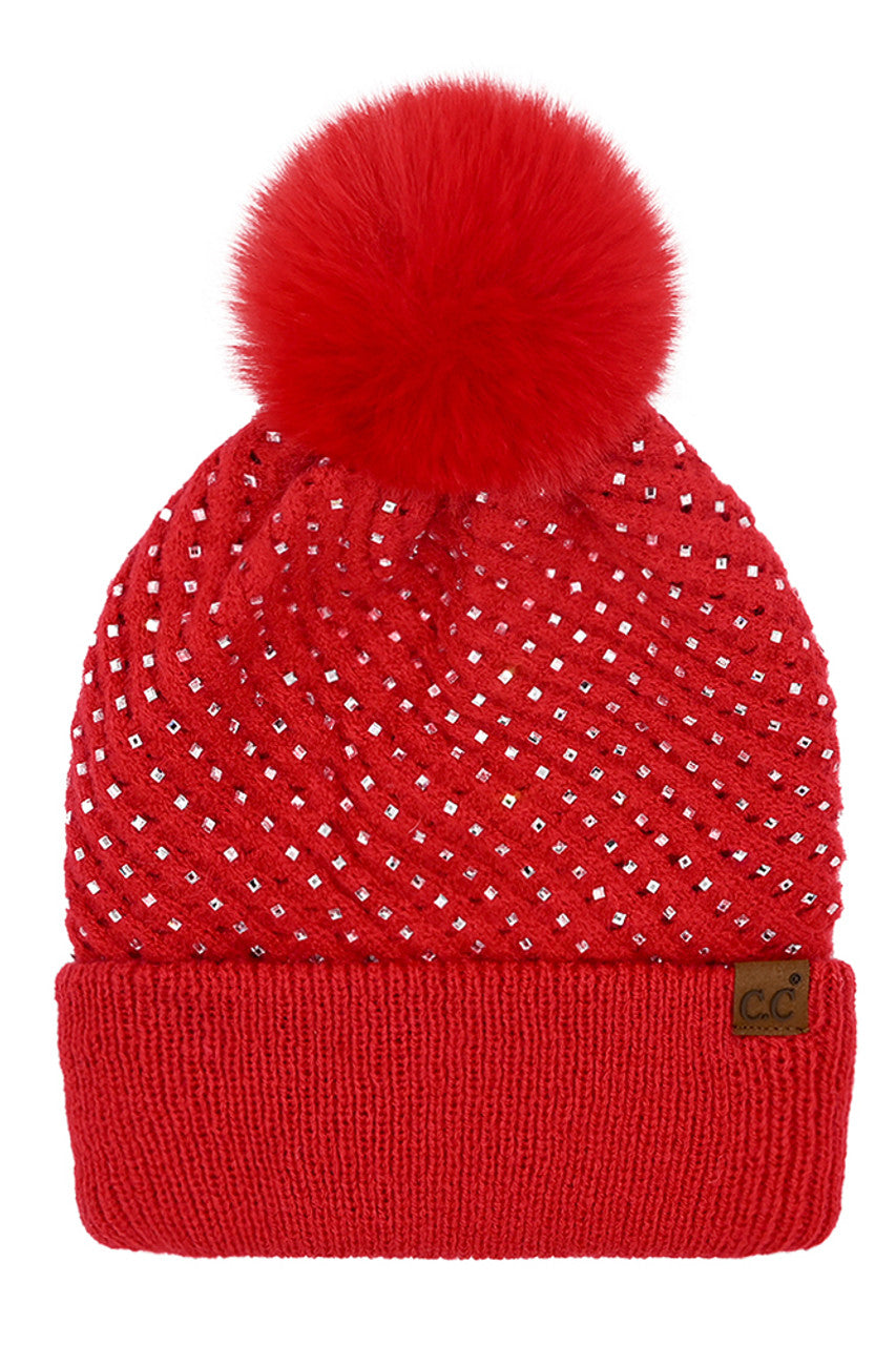 Red C.C Allover Rhinestone Pom Beanie combines expert craftsmanship with stylish practicality. Crafted from soft, warm knit material, this beanie is adorned with shimmering rhinestones for an elegant yet understated sparkle. The plush pom on top adds a classic touch while ensuring cozy protection against cold weather. Perfect for elevating your winter wardrobe, it offers a refined blend of comfort, durability, and sophistication.