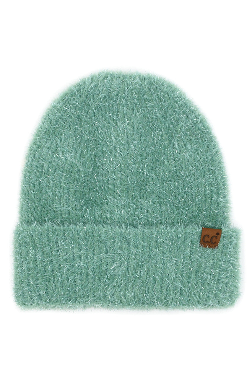 Sage_Wrap yourself in chic charm with the C.C Metallic Eyelash Cuff Solid Beanie. This beanie shimmers with metallic accents and features a playful eyelash cuff detail. Perfect for adding a touch of glamour to your everyday style, this beanie is a must-have accessory for chilly days or as a gift to your fashionable friends. Elevate your look effortlessly and stay cozy in style.