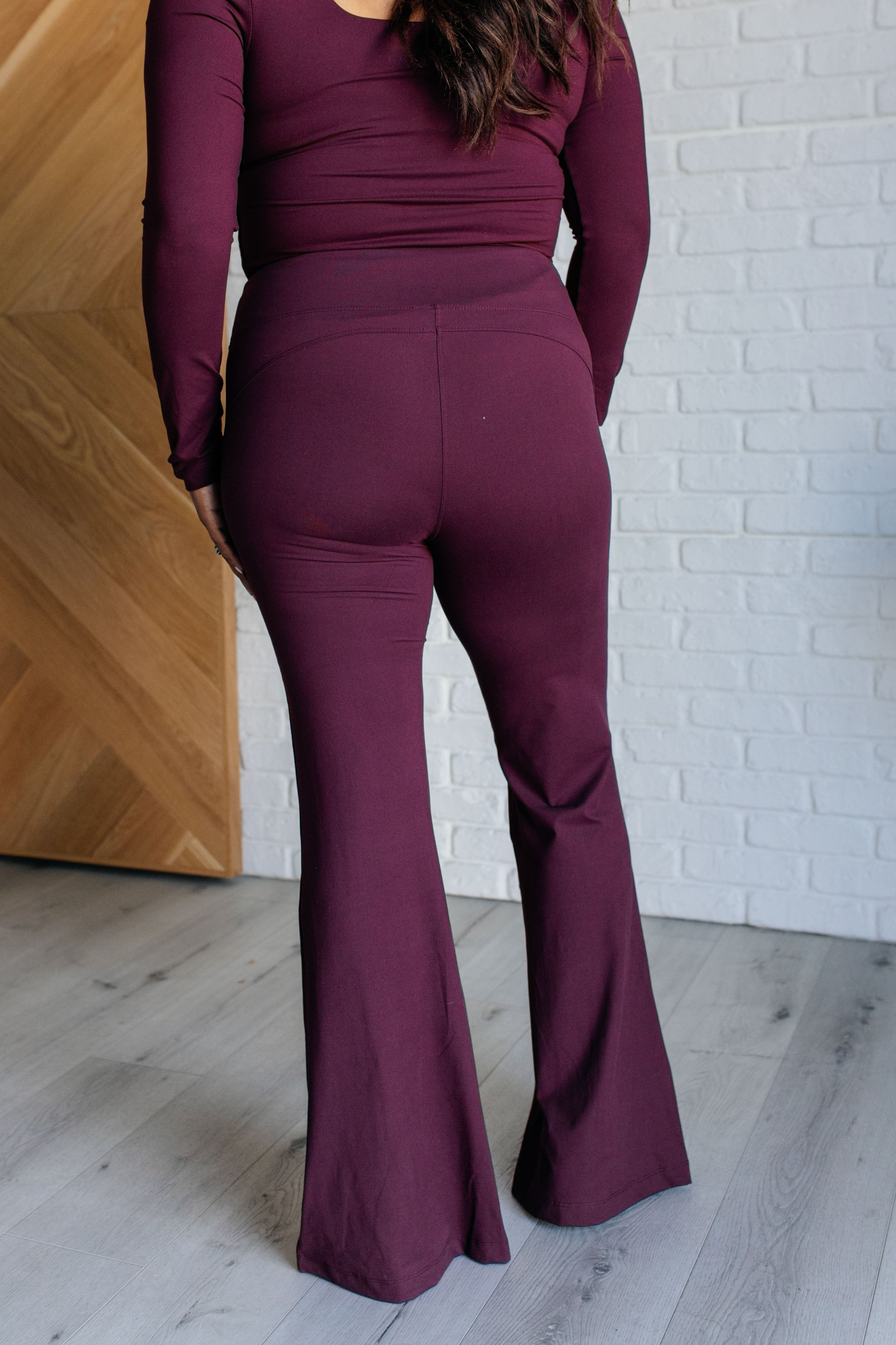 Stamina Stride Flare Leggings in Cassis - Charming Charlie