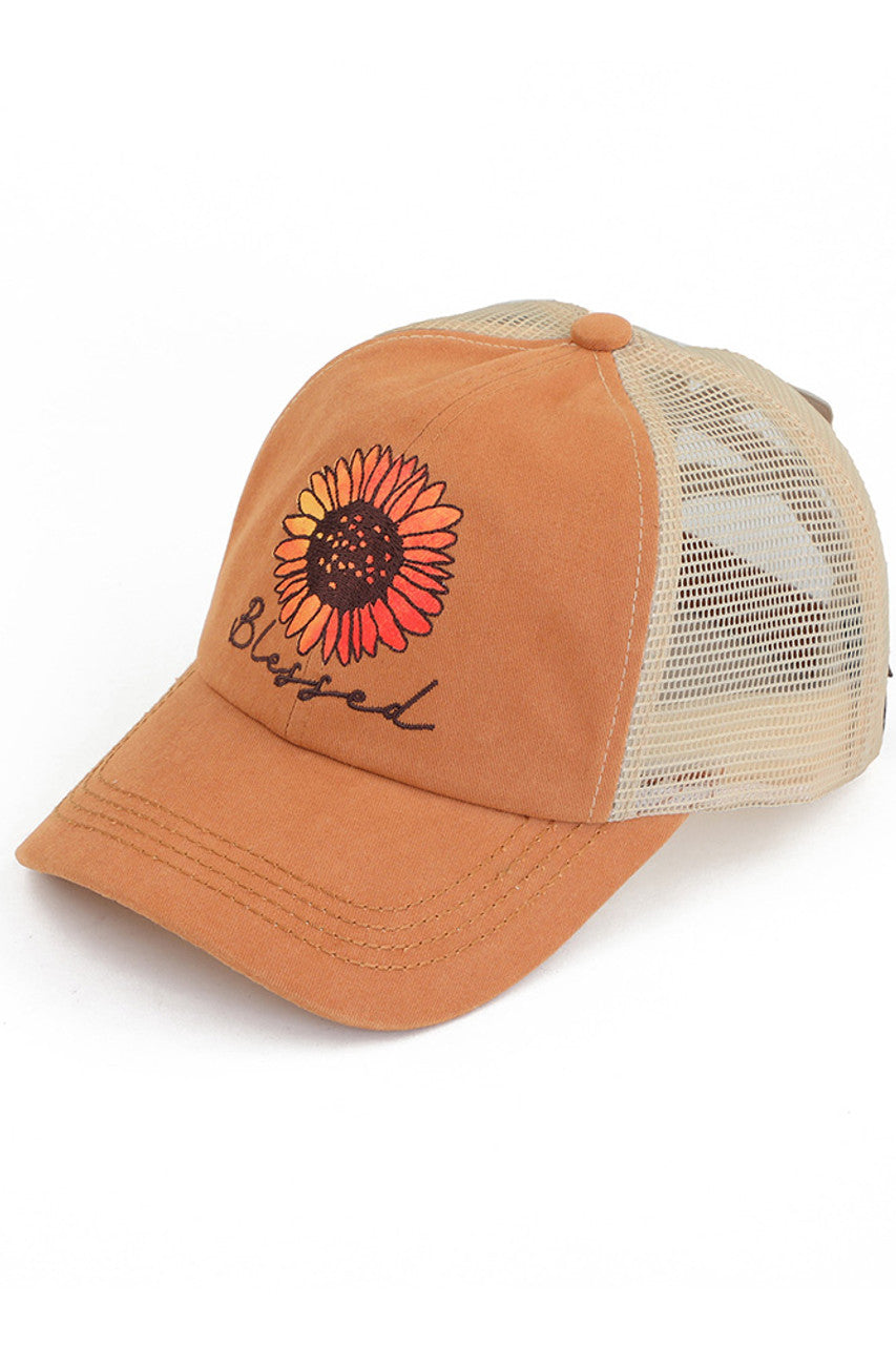 Texas Orange C.C DAISY PATCH BLESSED PONY CAP is the perfect accessory for any ponytail! With the bonus of a daisy patch, this cap not only keeps you in style but also adds a touch of femininity to your look. Keep your hair out of your face and elevate your outfit with this cap.