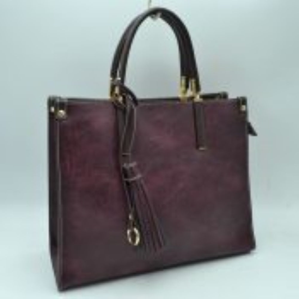 Violet Large Shoulder Vegan Leather Tassel Handbag For Women. High quality Vegan Leather is a luxurious and durable, Stay organized in style with this square-shaped shopper tote bag that is fully two contrasting interior and exterior solid colors. This vegan leather handbag includes an on-trend removable tassel embellishment. Guaranteed, This will be your go-to handbag. 