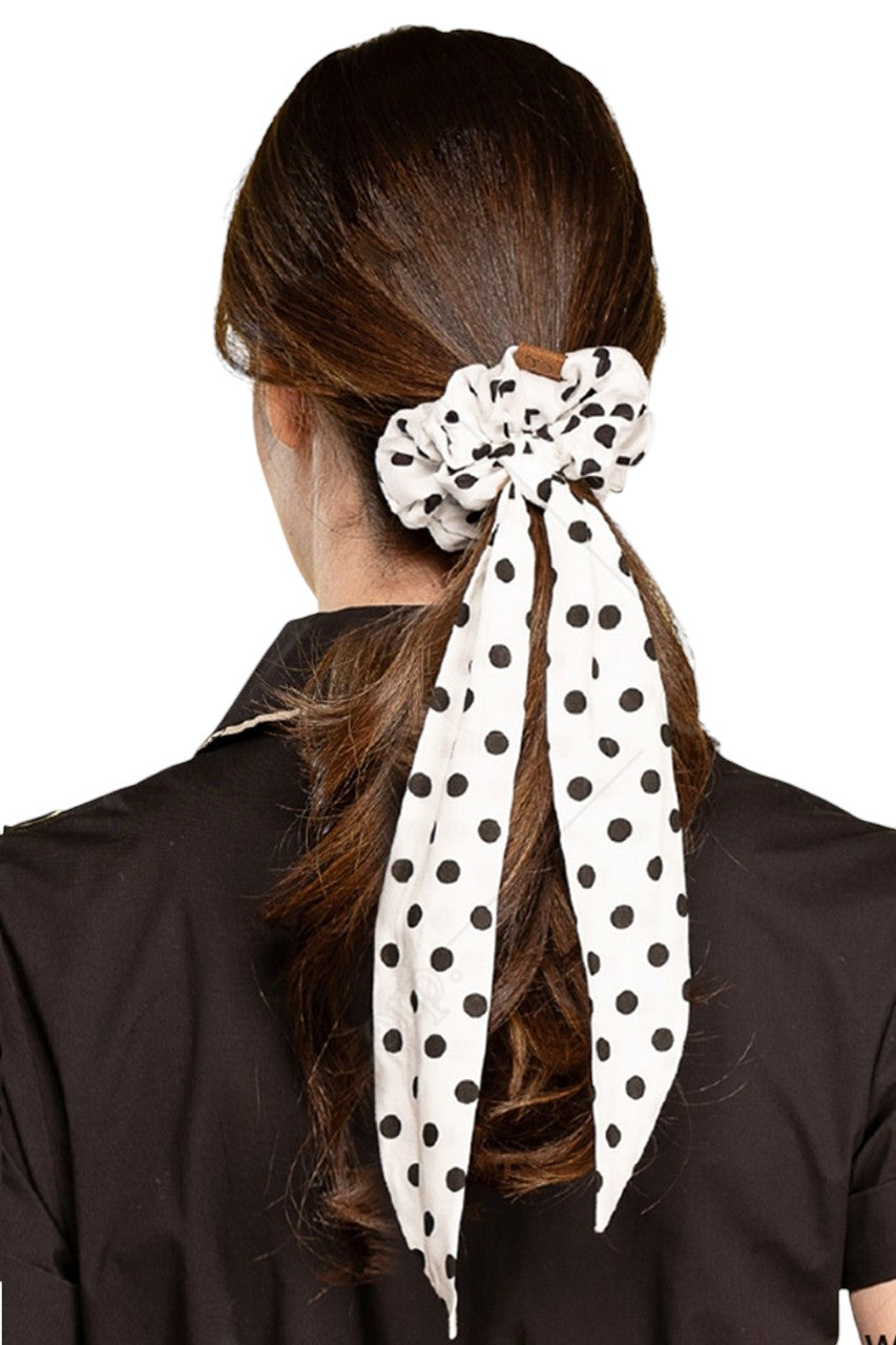White C.C. POLKA DOT SASH SCRUNCHIES offer a stylish and practical way to keep hair in place. With their fun polka dot design and handy sash, they are perfect for any hair type. Made with high-quality materials, these scrunchies are durable and comfortable for all-day wear.