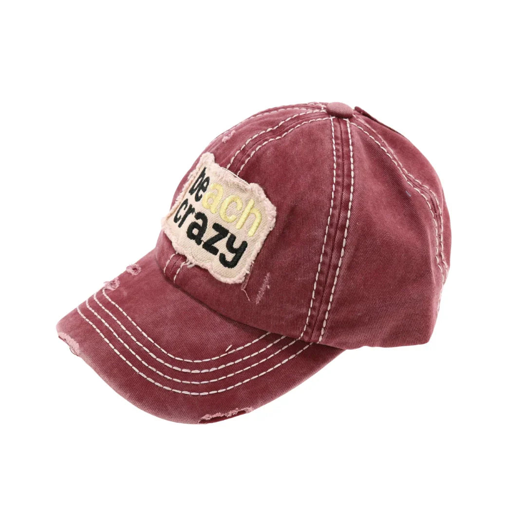 Beach Crazy Embroidered High Ponytail CC Ball Cap combines style and functionality, featuring an embroidered design that adds a distinctive touch. Its high ponytail opening ensures comfort and convenience for those with longer hair, making it ideal for outdoor activities. Crafted for durability and a secure fit, this cap offers both sun protection and a fashionable accessory for beach days or casual outings.