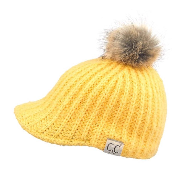 Banana C.C Kids Cable Knitted Brim Beanie Faux Fur Pom Pom Warm Winter Hat; reach for this classic toasty hat to keep you nice and warm in the chilly winter weather, the wintry touch finish to your outfit. Perfect Gift Birthday, Christmas, Holiday, Anniversary, Stocking Stuffer, Secret Santa, Valentine's Day, Loved One, BFF