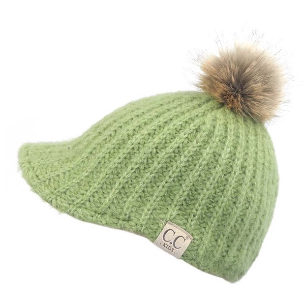 Pistachio C.C Kids Cable Knitted Brim Beanie Faux Fur Pom Pom Warm Winter Hat; reach for this classic toasty hat to keep you nice and warm in the chilly winter weather, the wintry touch finish to your outfit. Perfect Gift Birthday, Christmas, Holiday, Anniversary, Stocking Stuffer, Secret Santa, Valentine's Day, Loved One, BFF
