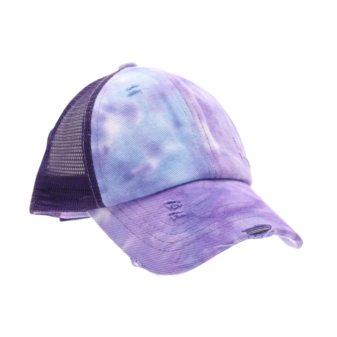 Purple C.C Kids Tie Dye Criss-Cross Ponycap combines playful tie-dye patterns with a practical criss-cross design, ensuring a secure and comfortable fit for active children. Crafted for durability and style, this ponytail keeps hair neatly in place while adding a vibrant touch to any outfit. Ideal for everyday wear, it offers both function and fashion for young, energetic lifestyles.