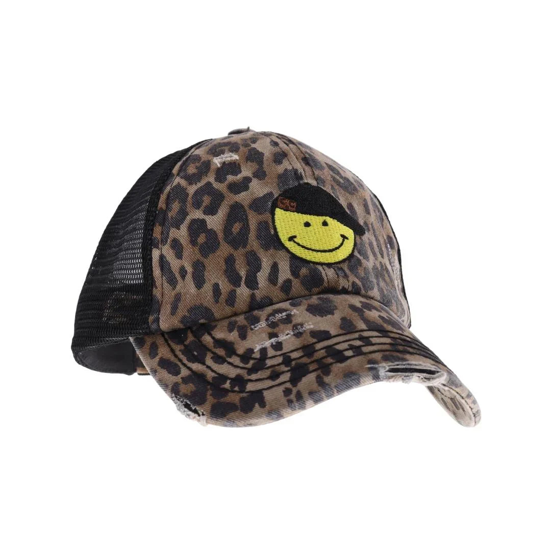 BabyLeopard C.C Smiley Face Embroidered Criss Cross High Pony C.C Ball Cap combines practical design with playful style. Featuring an embroidered smiley face and a criss-cross opening at the back, this cap is tailored to comfortably fit high ponytails. Made from durable, breathable fabric, it ensures a secure fit and all-day comfort, making it an excellent choice for active lifestyles or casual wear. This cap offers a smart solution for those who want to keep their hair up without sacrificing style.