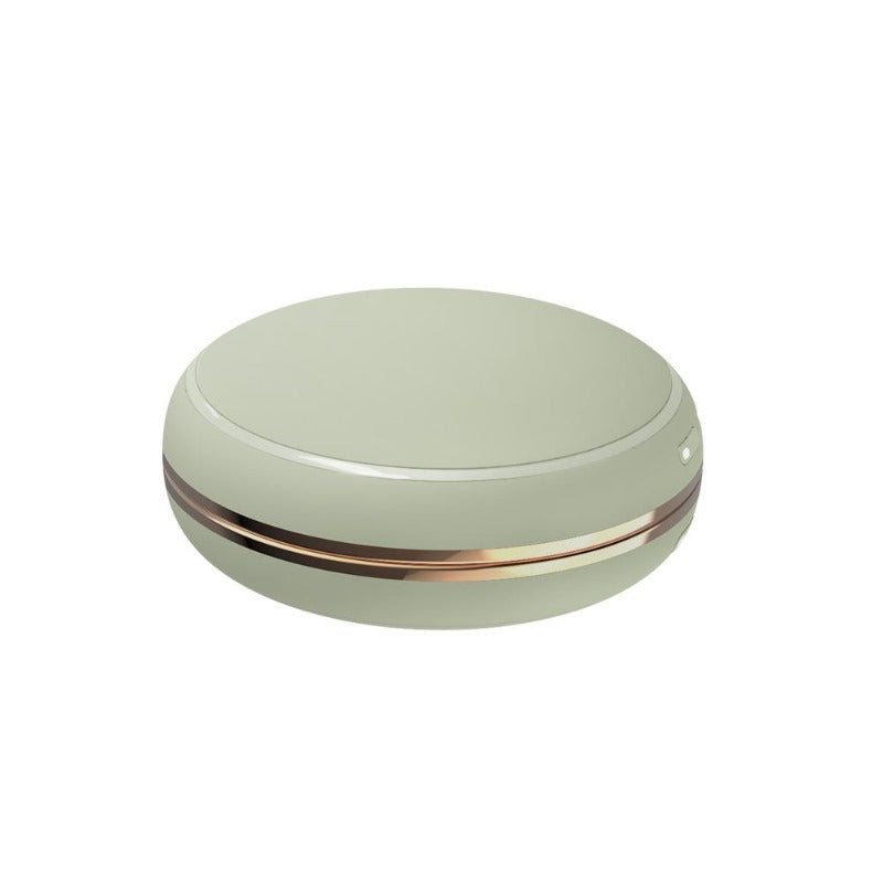 Fun power bank hand warmer shaped like green macarons