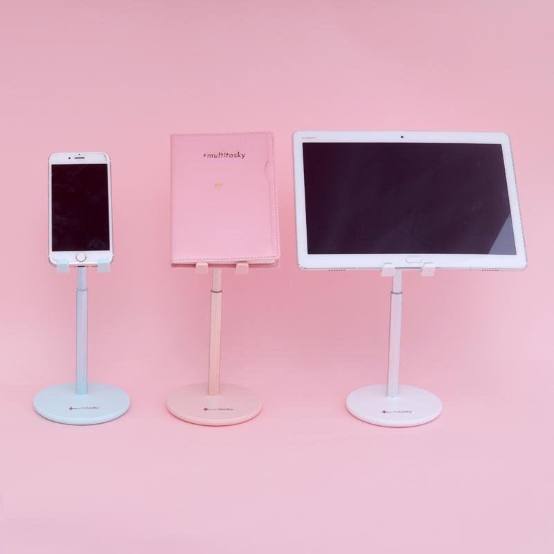 Adjustable cell phone stand for desk in blue, pink, and white