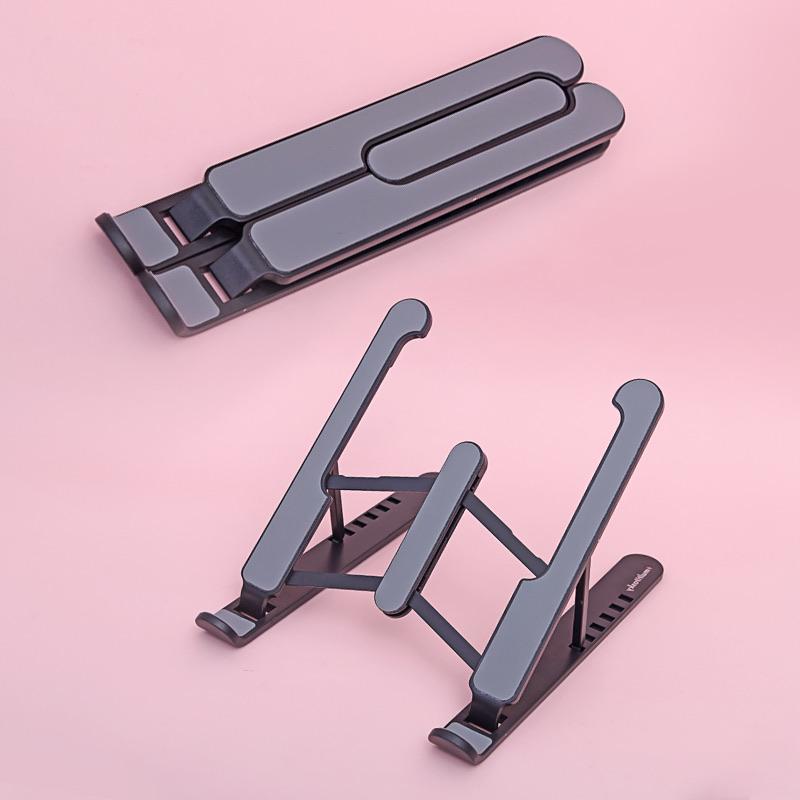 The portable laptop stand when in-use and folded - in black