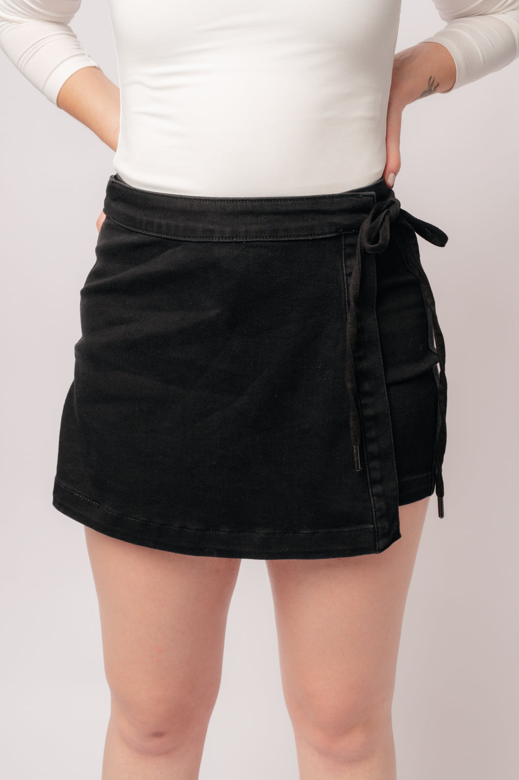 Bentli High Rise Side Tie Denim Skort in Black - Charming Charlie